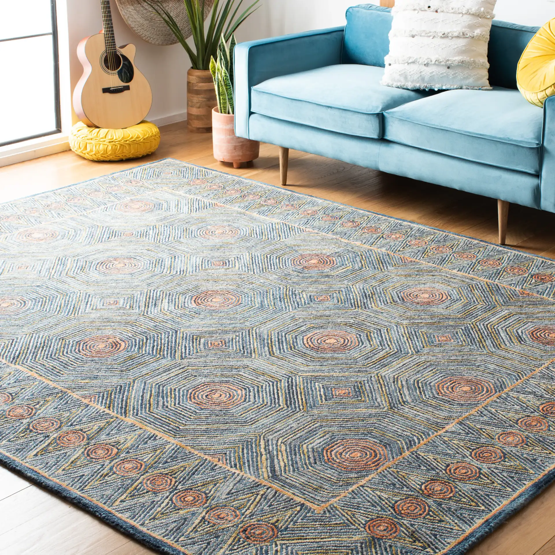 Micro-Loop Concentric Geometric Hand-Tufted Wool Rug in Green / Blue in a styled room