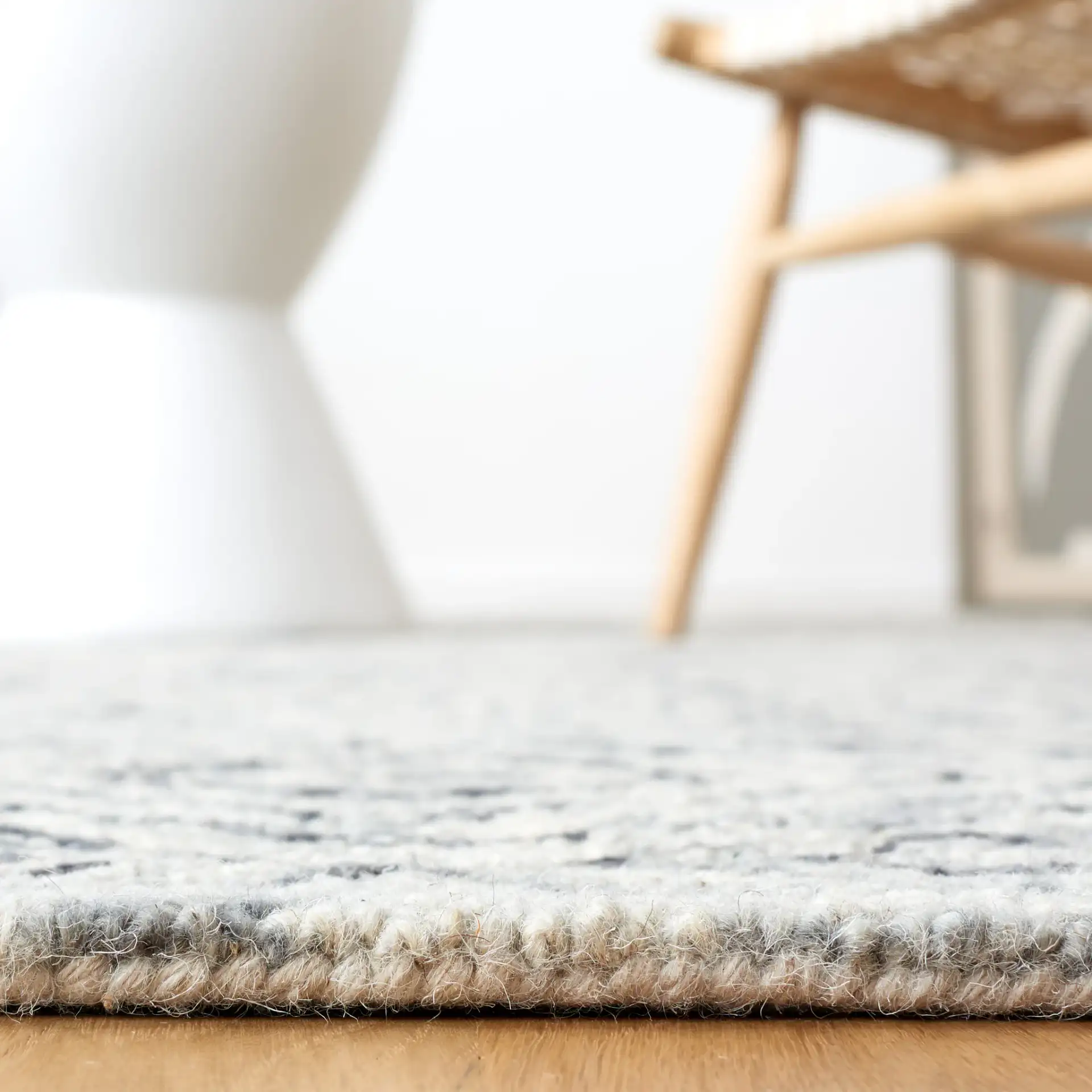 Micro-Loop Tile Lattice Hand-Tufted Wool Rug in Gray / Beige in a styled room