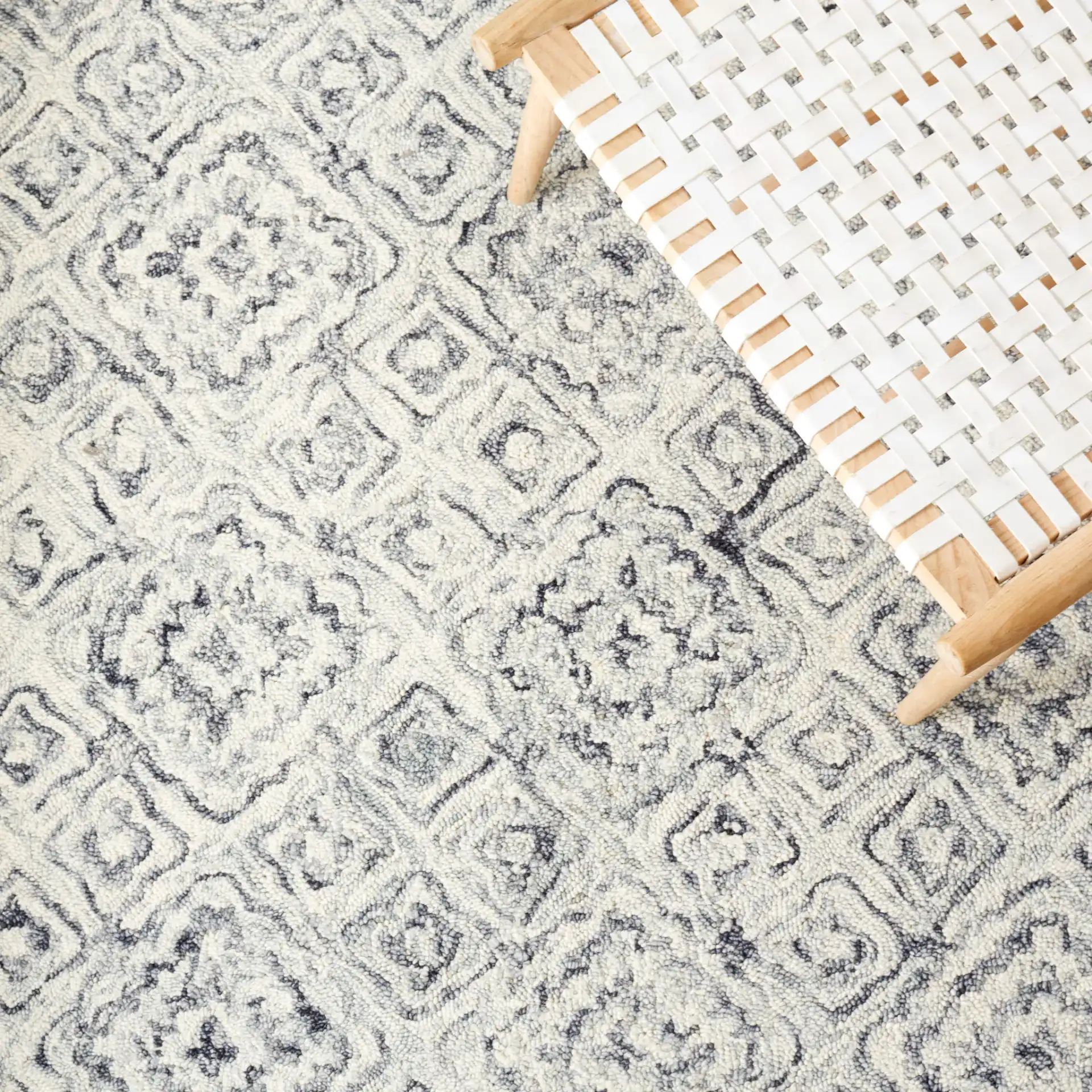 Micro-Loop Tile Lattice Hand-Tufted Wool Rug in Gray / Beige in a styled room