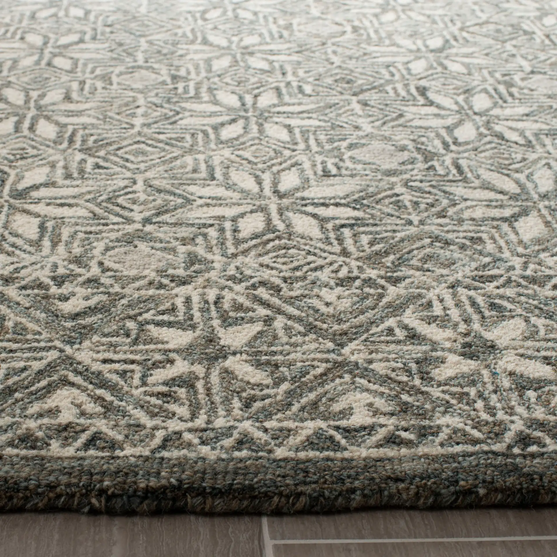 Micro-Loop Geometric Lattice Hand-Tufted Wool Rug in Blue / Ivory in a styled room