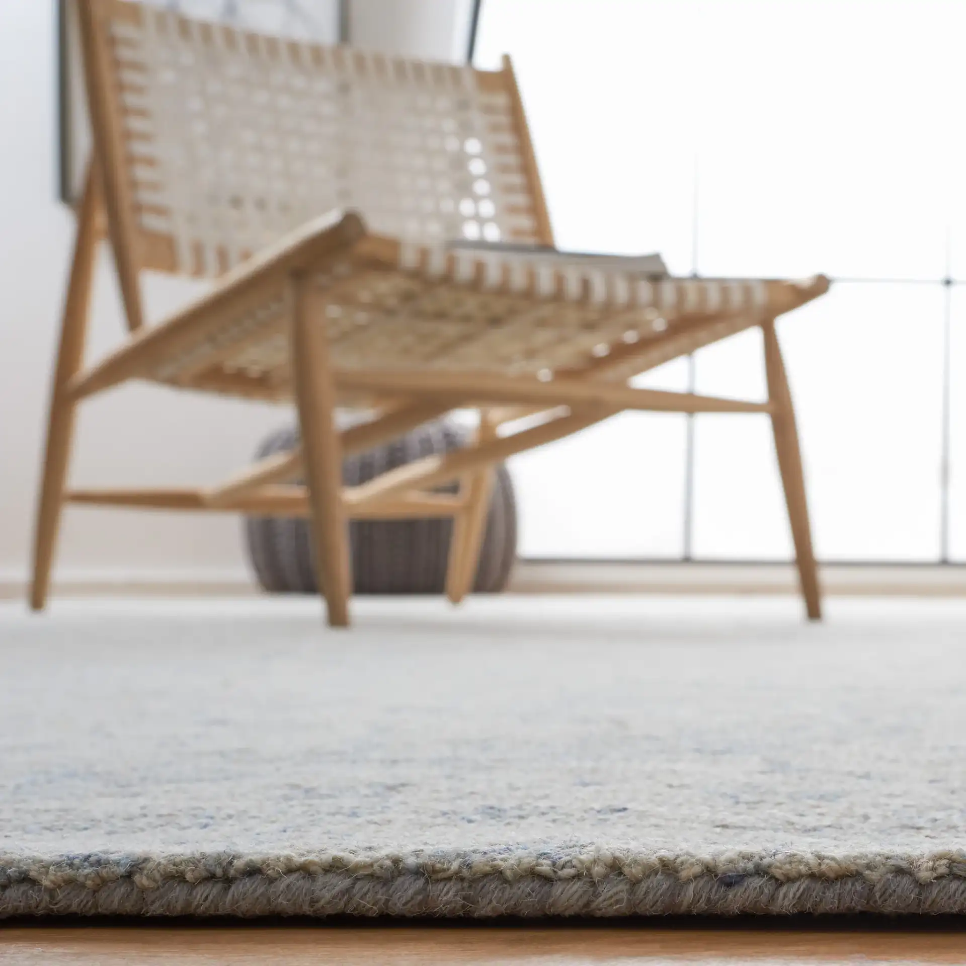 Micro-Loop Botanical Trellis Hand-Tufted Wool Rug in Gray / Blue in a styled room