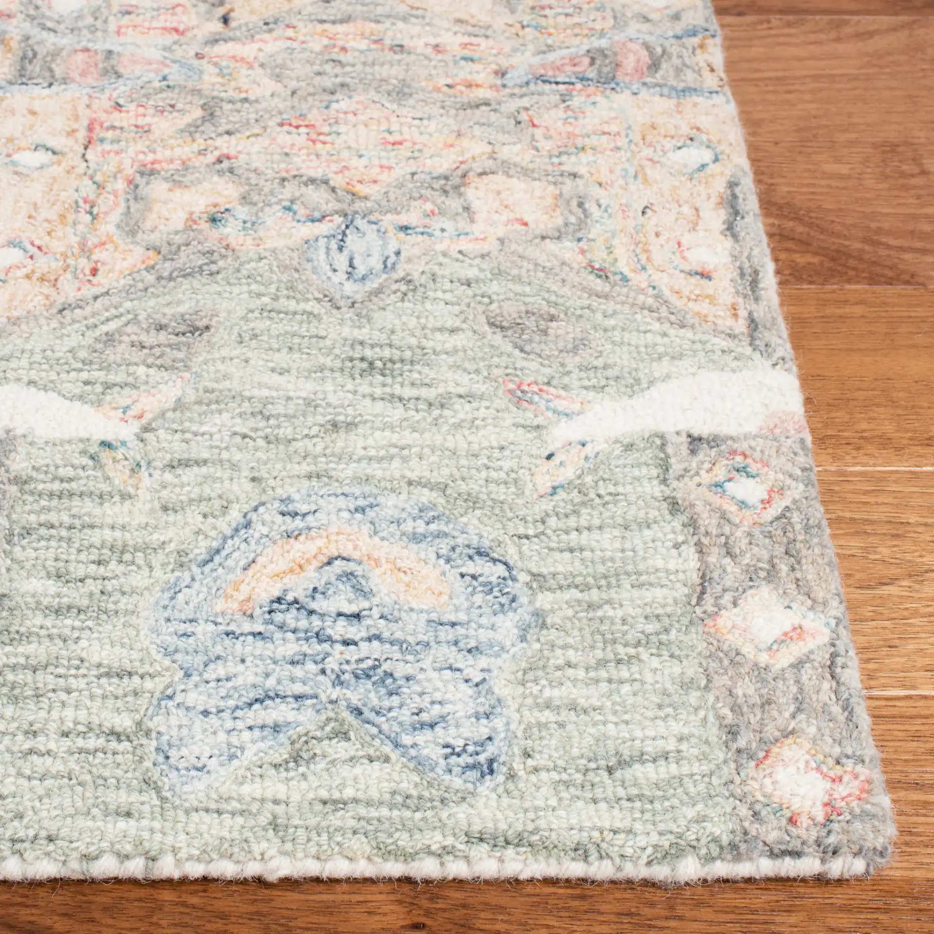 Micro-Loop Botanical Border Hand-Tufted Wool Rug in Ivory / Blue in a styled room