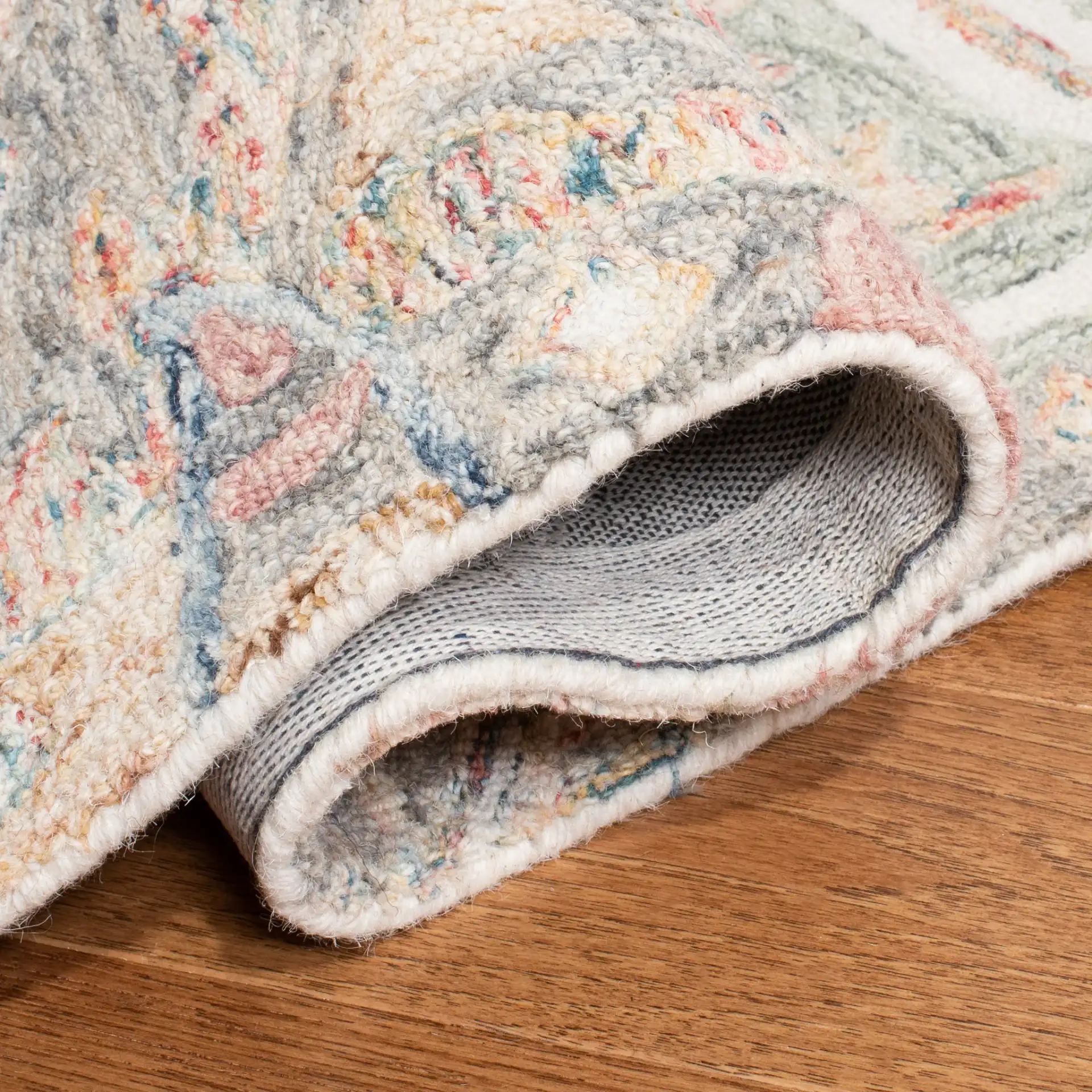 Micro-Loop Botanical Border Hand-Tufted Wool Rug in Ivory / Blue in a styled room