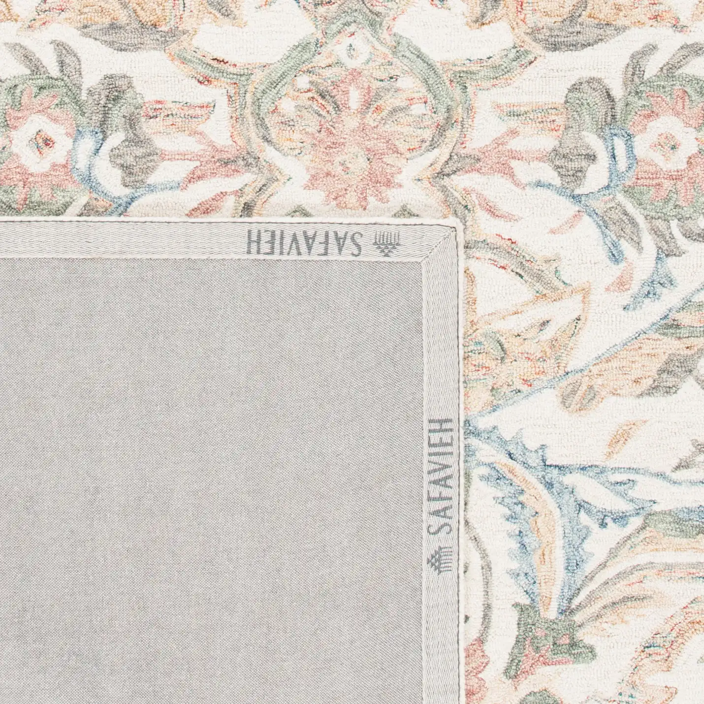 Micro-Loop Botanical Border Hand-Tufted Wool Rug in Ivory / Blue in a styled room