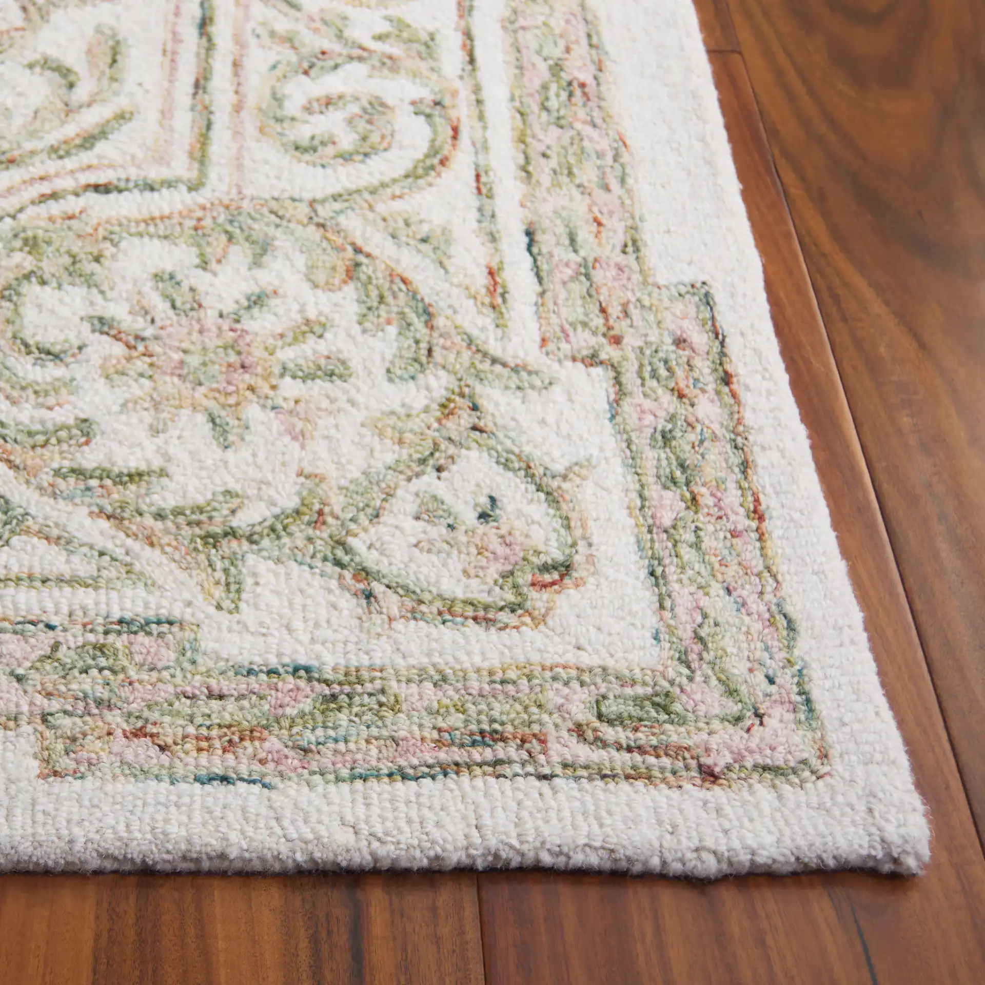 Micro-Loop Oval Medallion Hand-Tufted Wool Rug in Ivory / Fuchsia in a styled room