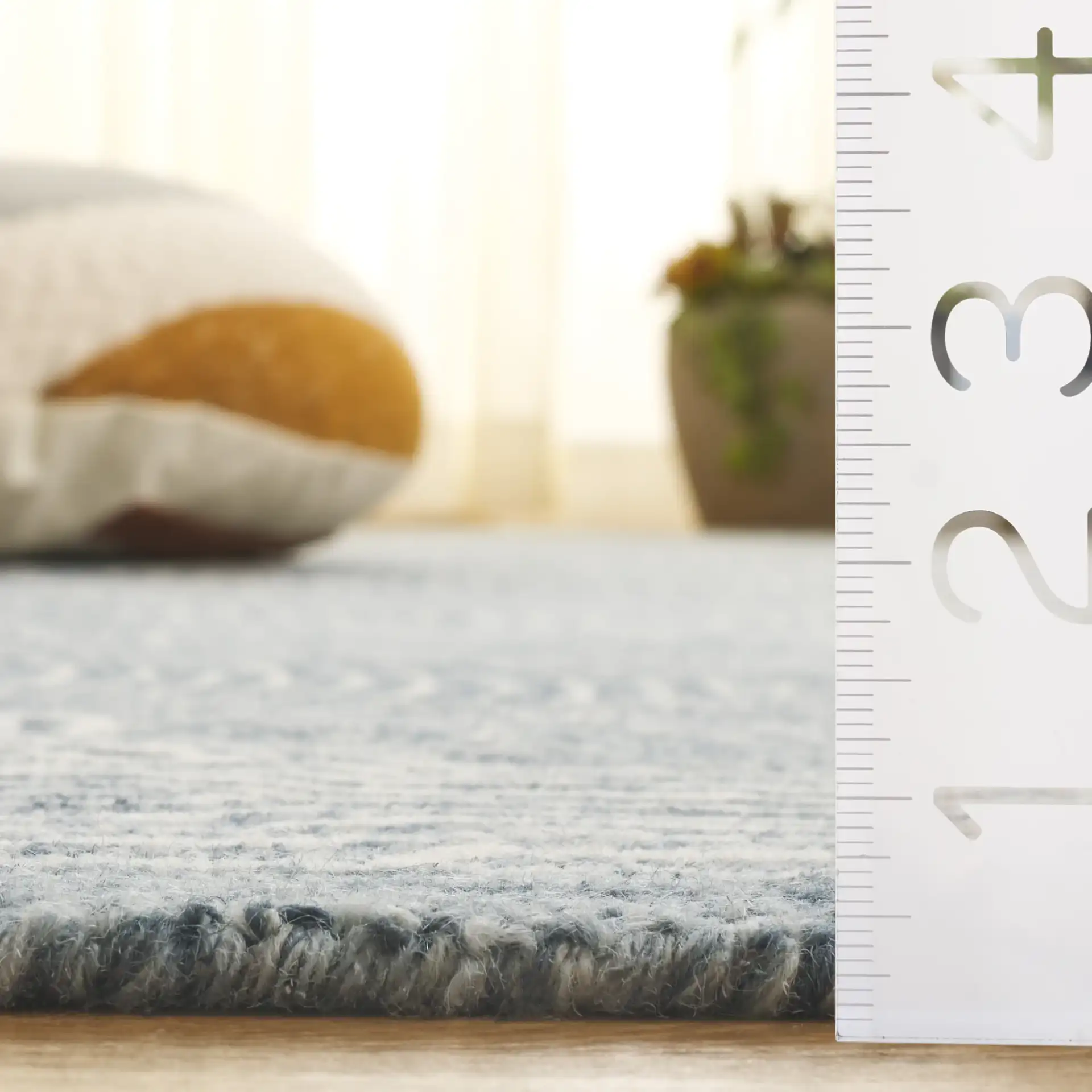 Micro-Loop Concentric Oval Hand-Tufted Wool Rug in Navy / Ivory in a styled room
