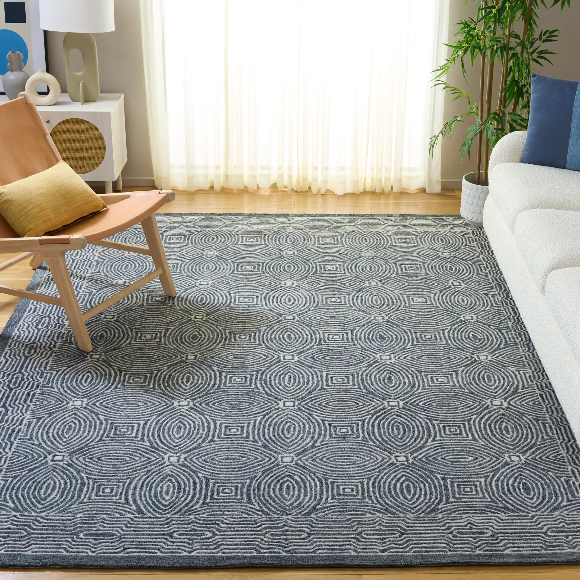 Micro-Loop Concentric Oval Hand-Tufted Wool Rug in Navy / Ivory in a styled room