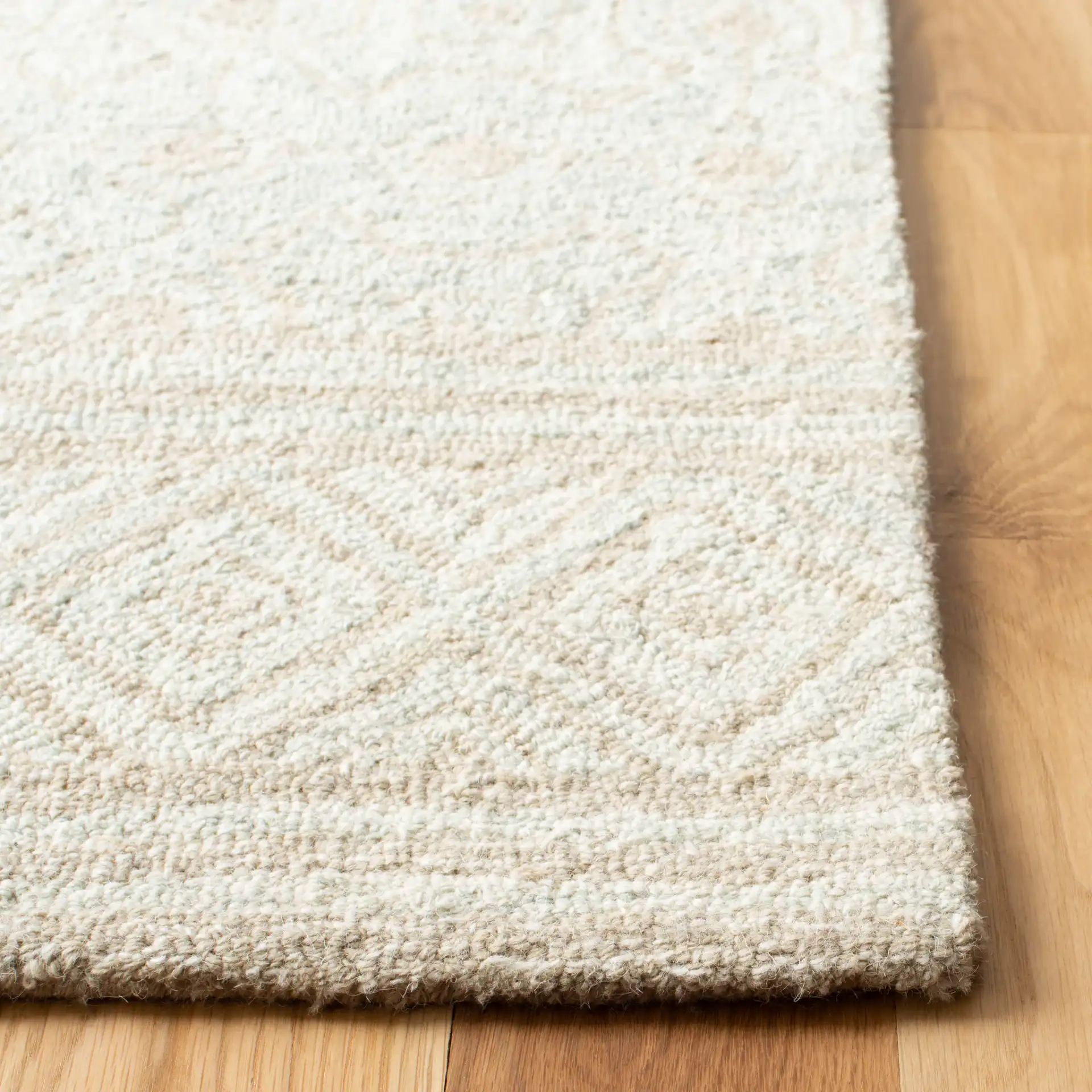 Micro-Loop Geometric Tile Hand-Tufted Wool Rug in Ivory / Light Green in a styled room