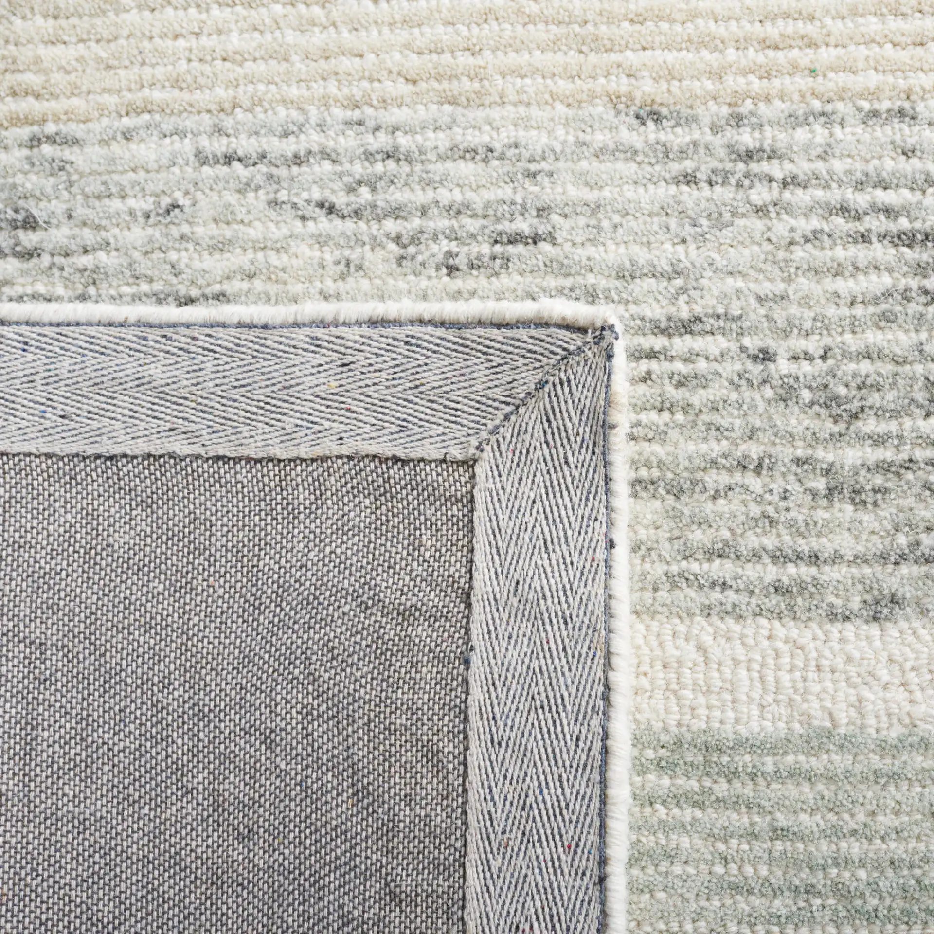 Micro-Loop Abstract Block Hand-Tufted Wool Rug in Ivory / Gray in a styled room