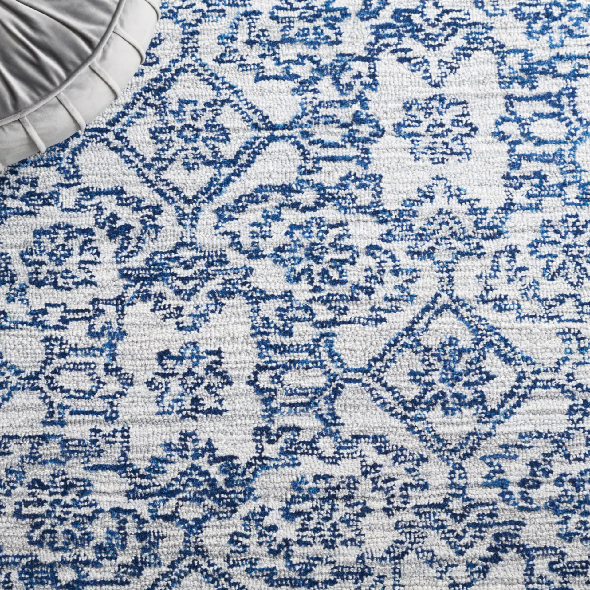 Micro-Loop Distressed Diamond Hand-Tufted Wool Rug in Blue in a styled room