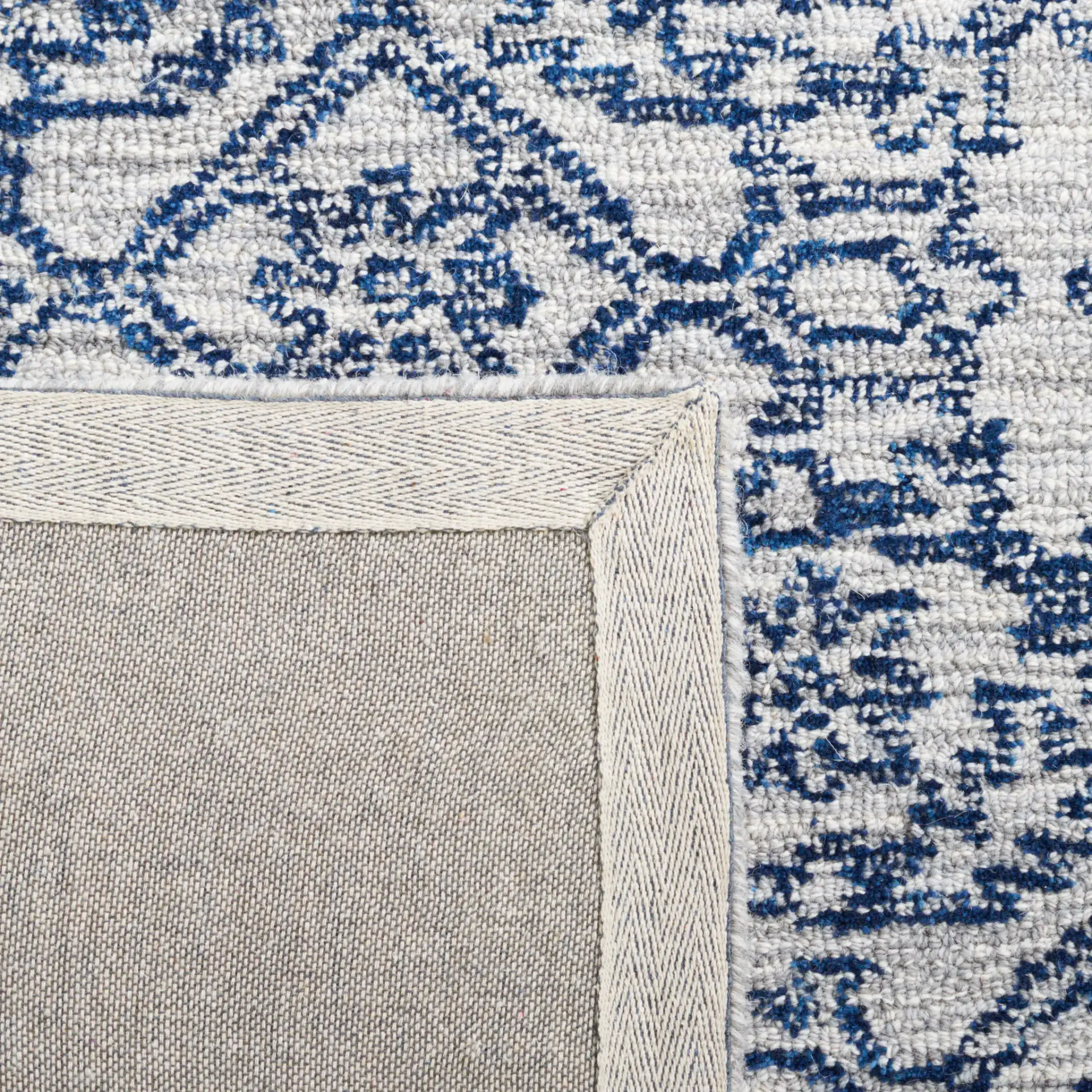 Micro-Loop Distressed Diamond Hand-Tufted Wool Rug in Blue in a styled room