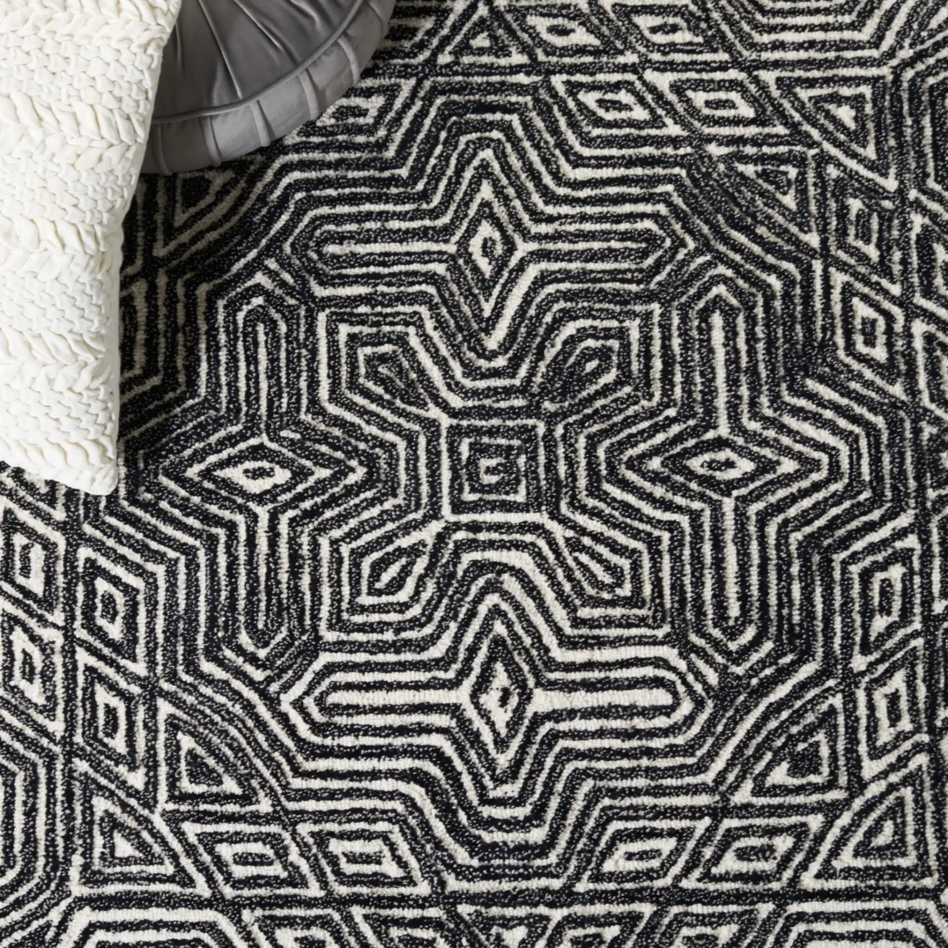 Micro-Loop Maze Hand-Tufted Wool Rug in Ivory / Black in a styled room