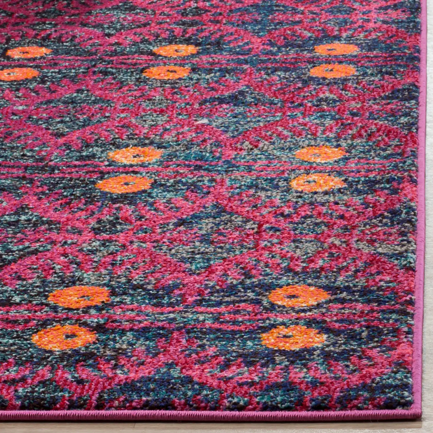 Monaco Tribal Diamond Rug in Pink / Multicolor in a styled room