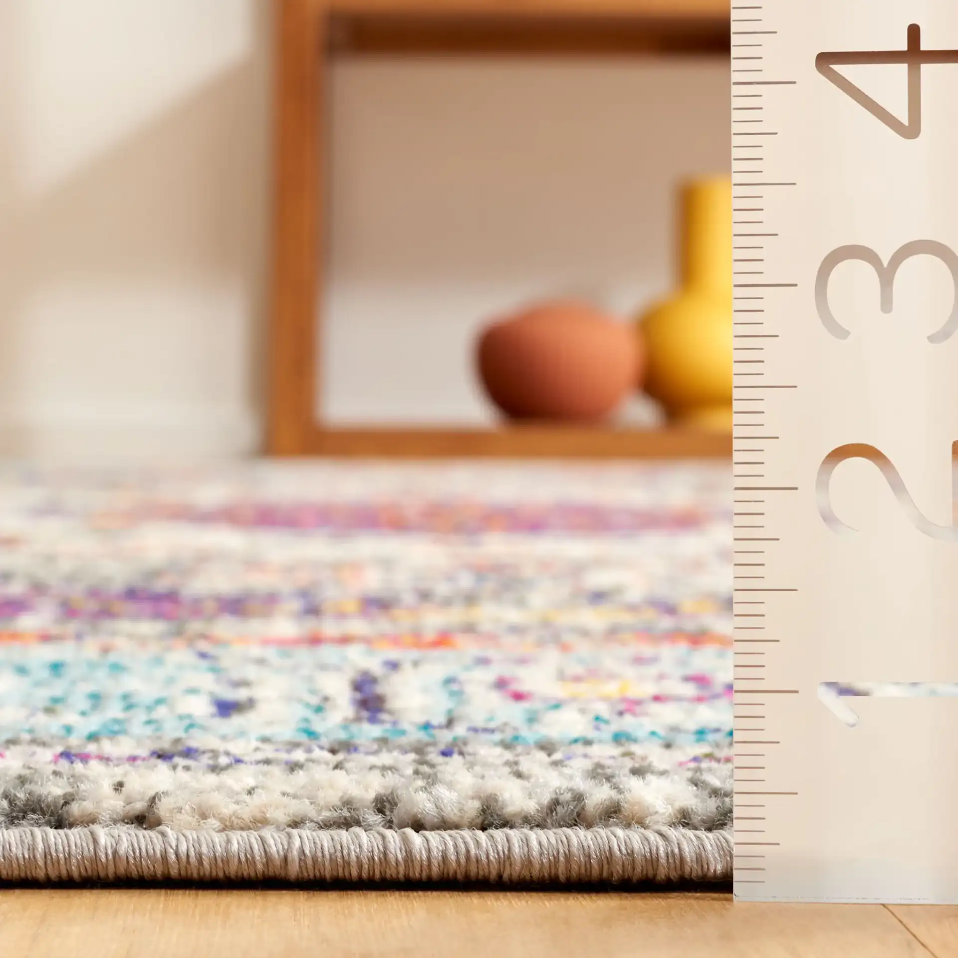 Monaco Medallion Bordered Rug in Violet / Light Blue in a styled room