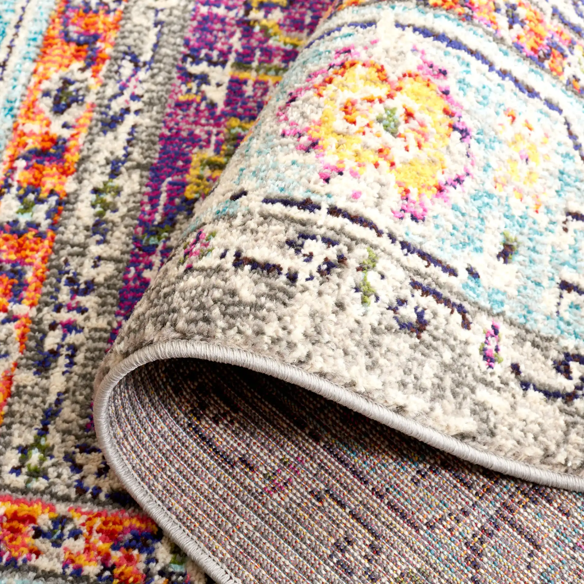 Monaco Medallion Bordered Rug in Violet / Light Blue in a styled room