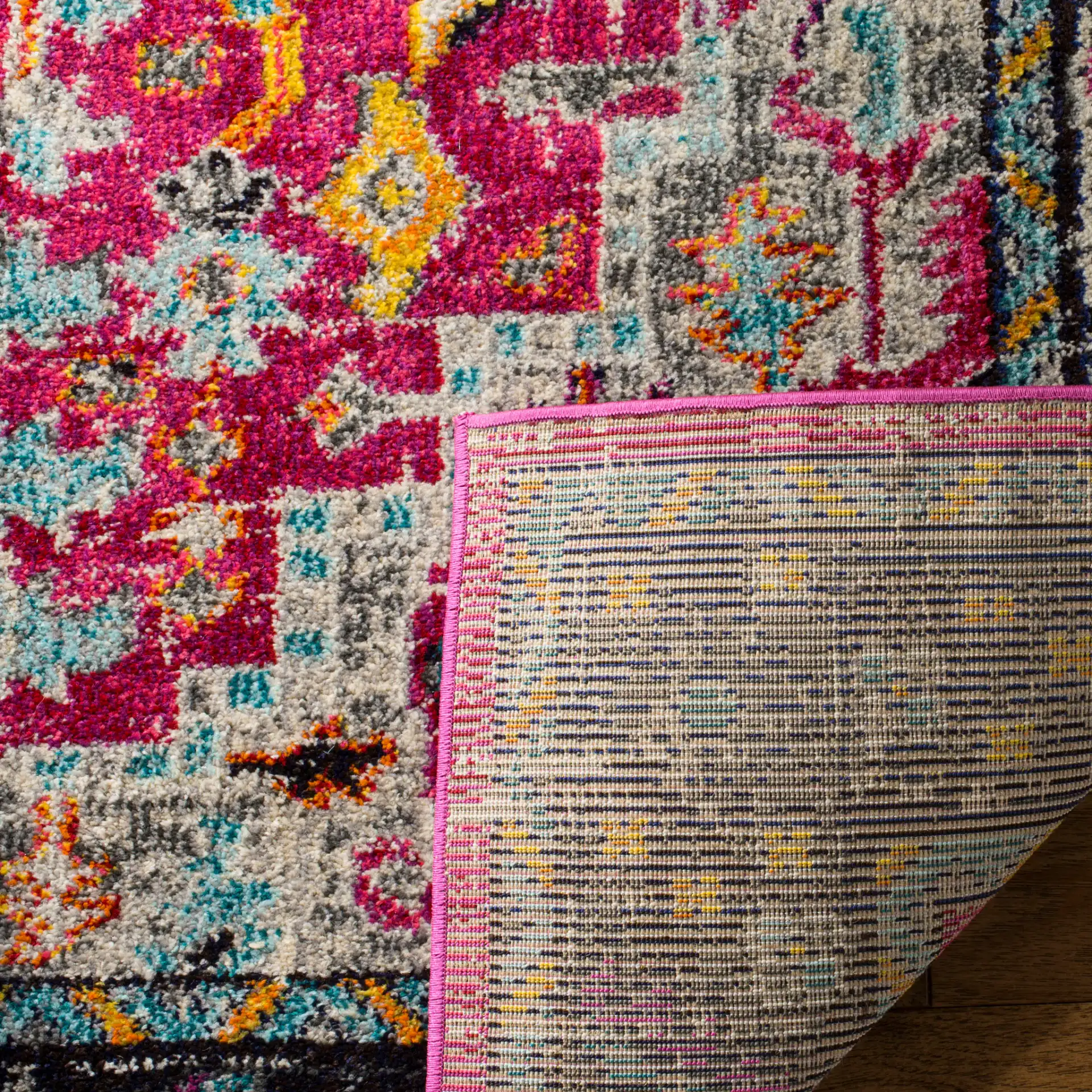 Monaco Square Medallion Bordered Rug in Fuchsia / Gray in a styled room