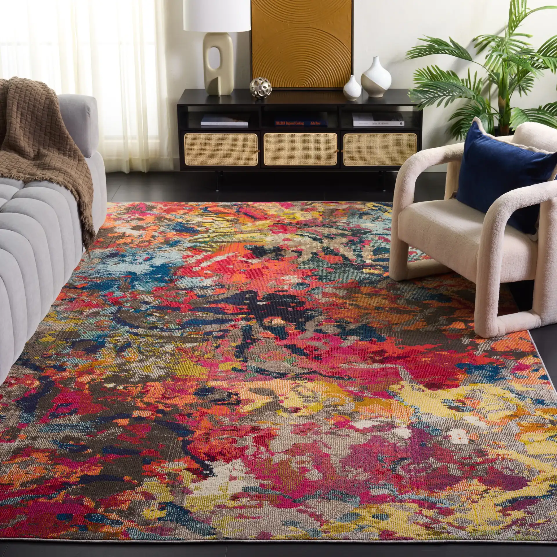 Monaco Abstract Splatter Rug in Blue / Orange in a styled room