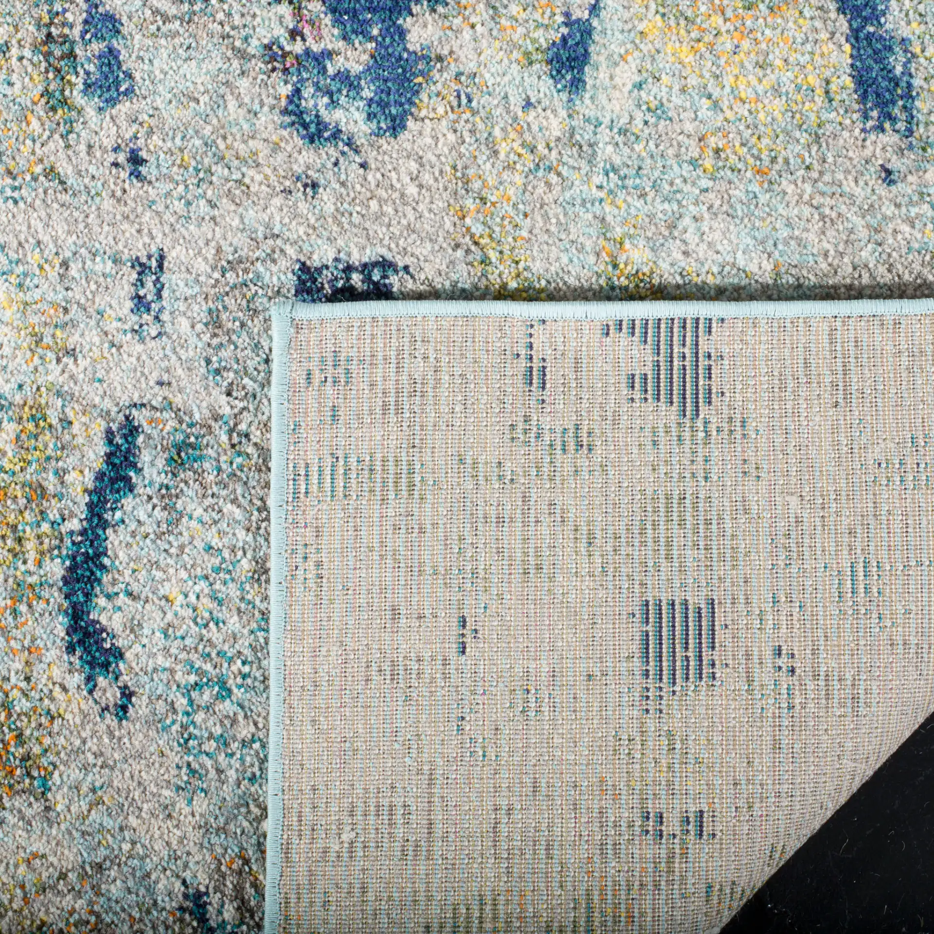 Monaco Horizontal Abstract Rug in Blue / Gray in a styled room
