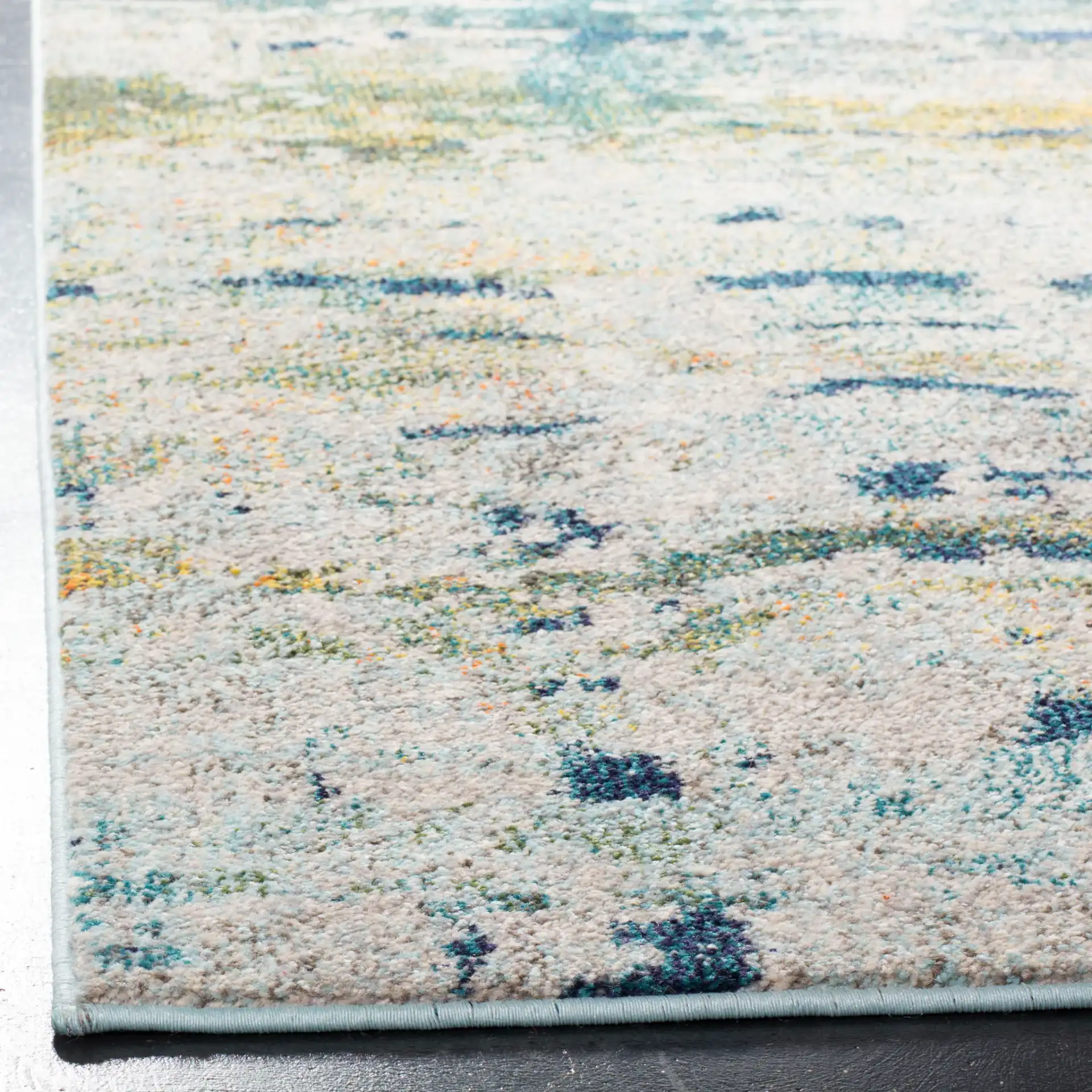 Monaco Horizontal Abstract Rug in Blue / Gray in a styled room