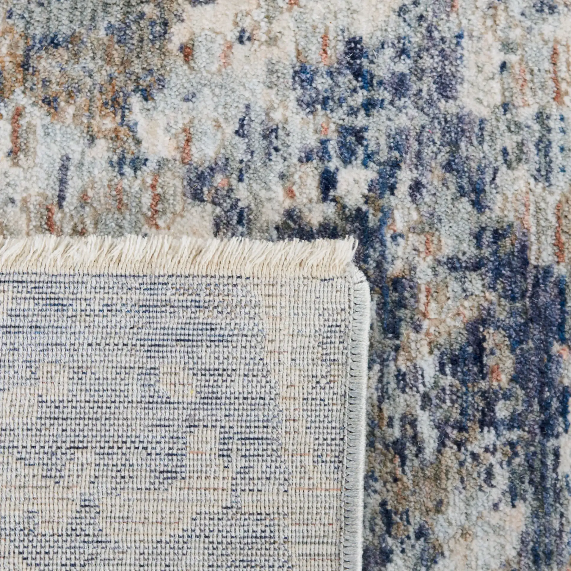 Moondust Textured Abstract Rug in Gray / Blue in a styled room