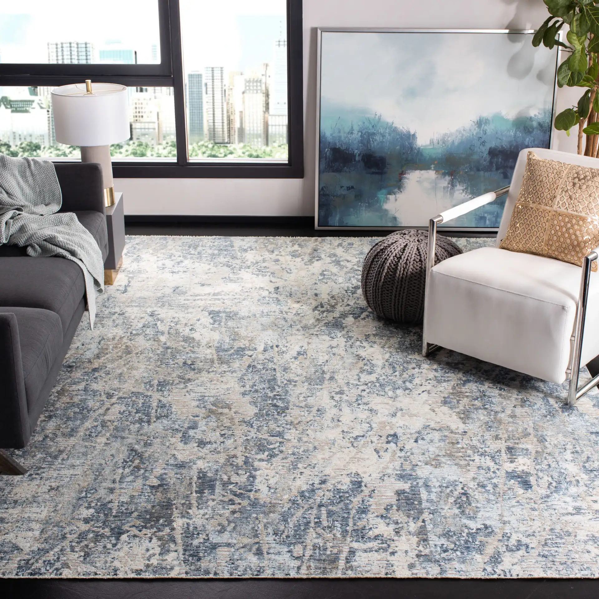 Moondust Textured Abstract Rug in Gray / Blue in a styled room