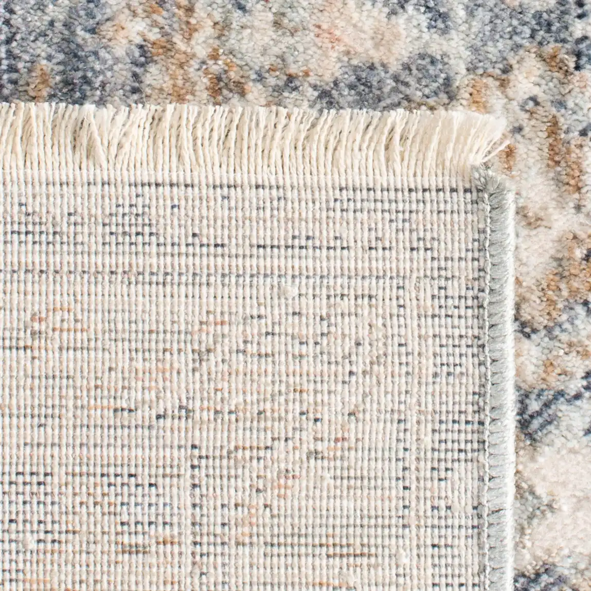 Moondust Distressed Rosette Rug in Blue / Ivory in a styled room