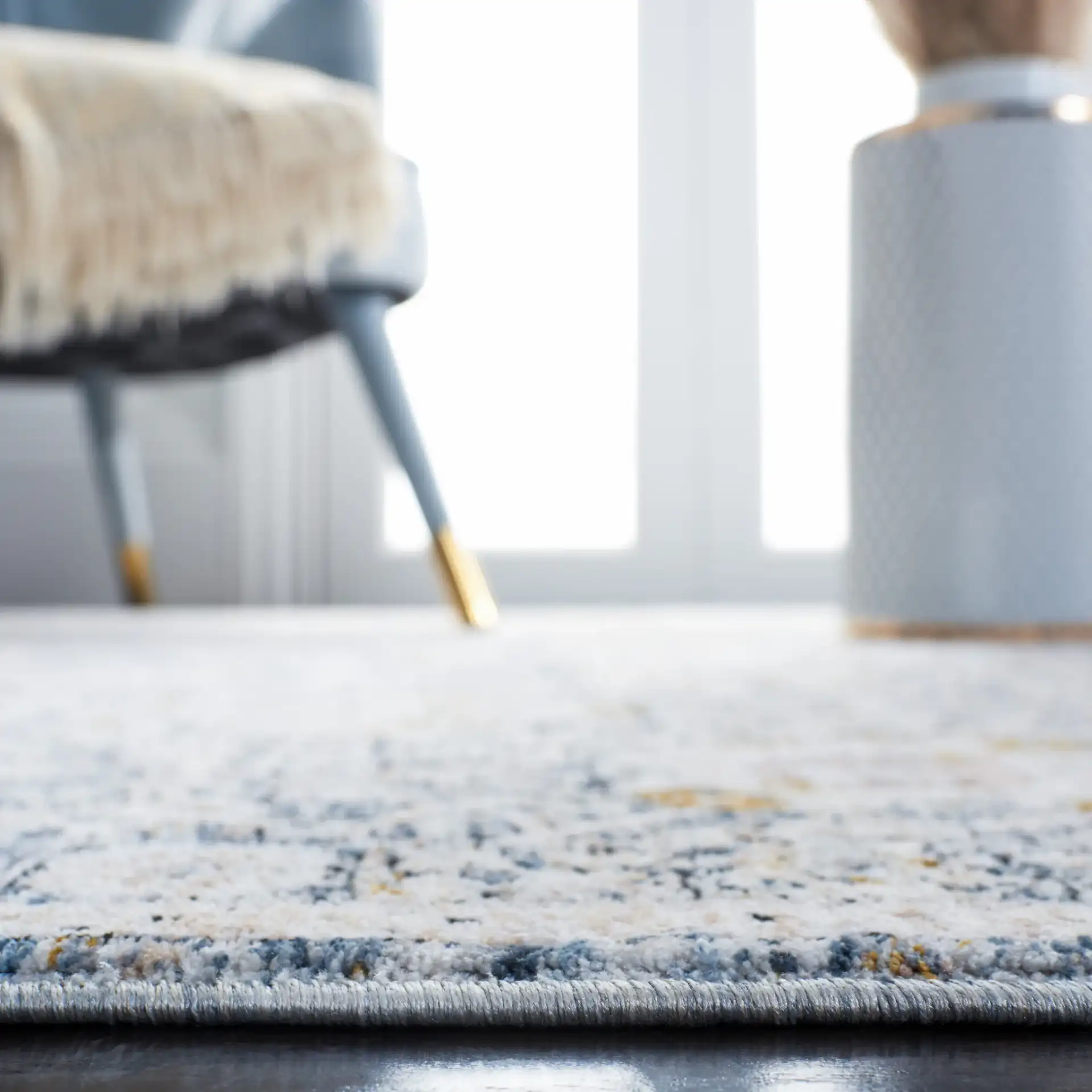 Moondust Floral Bordered Rug in Ivory / Gray in a styled room