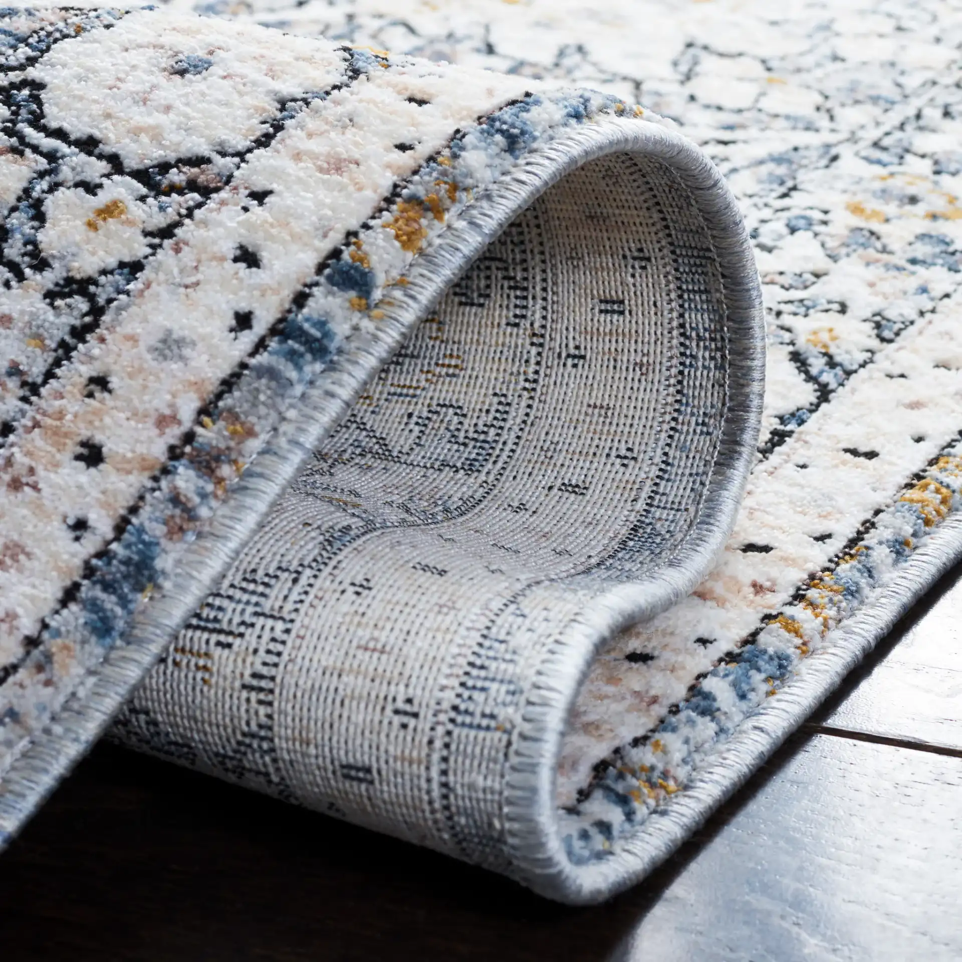 Moondust Floral Bordered Rug in Ivory / Gray in a styled room
