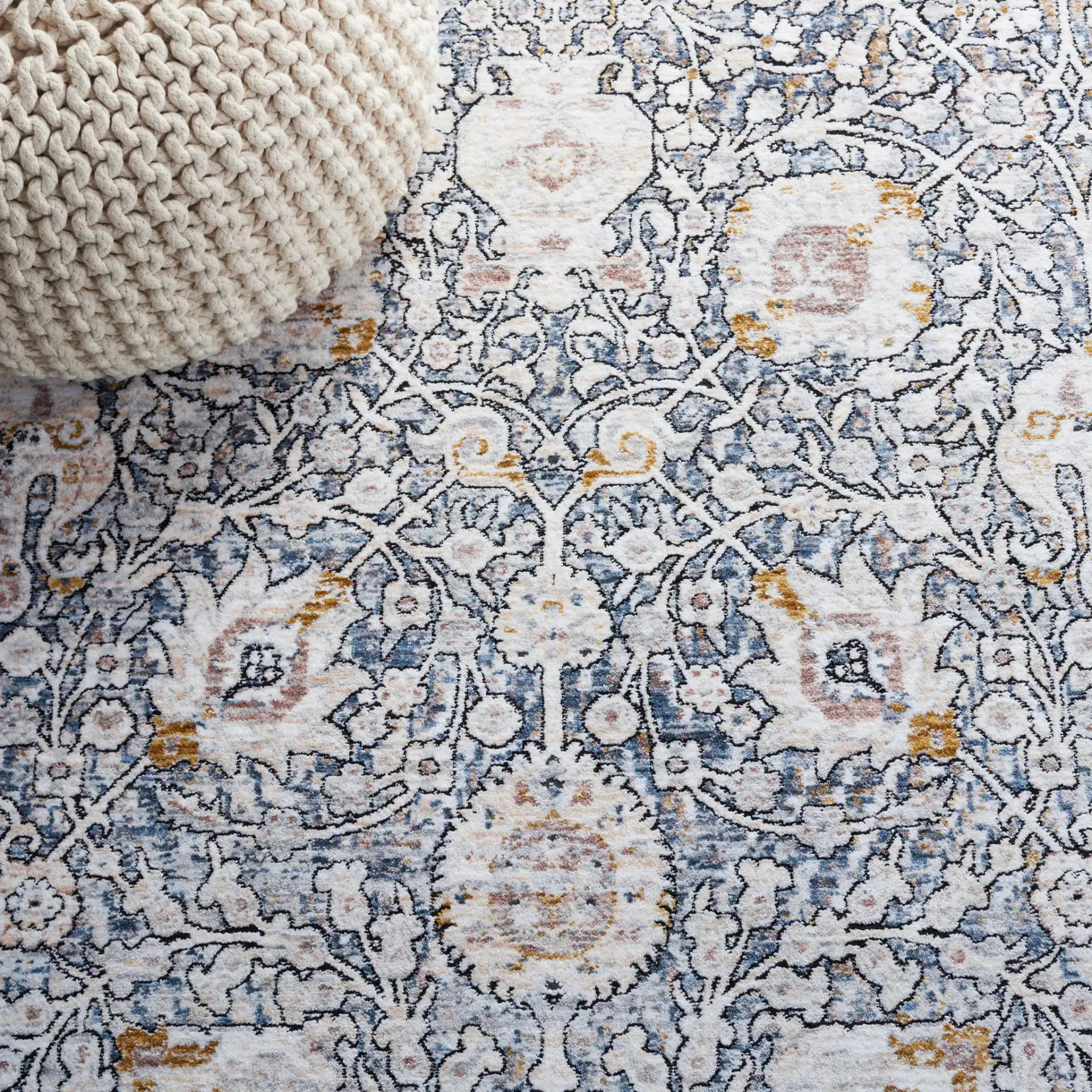 Moondust Floral Bordered Rug in Ivory / Gray in a styled room