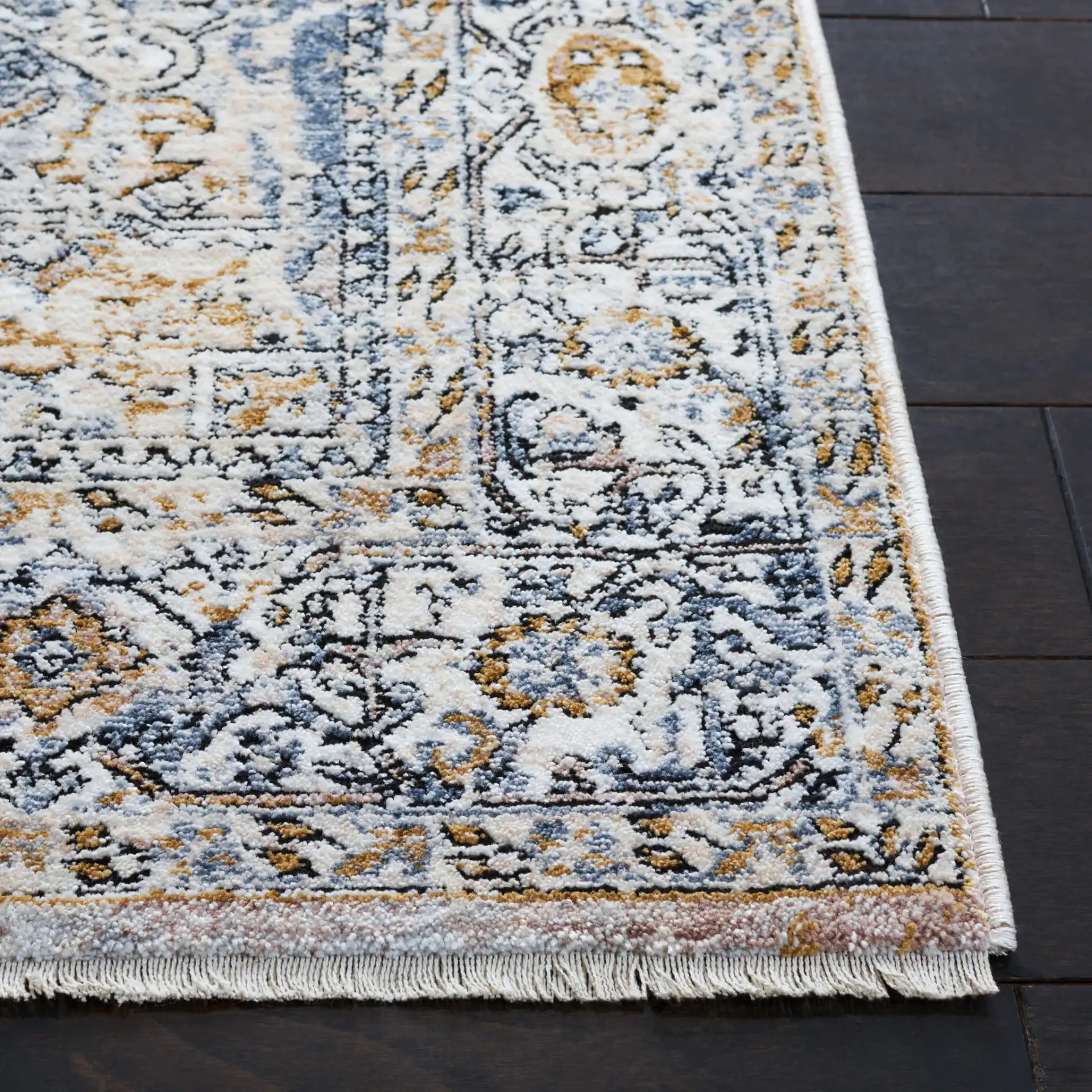Moondust Distressed Medallion Rug in Ivory / Blue in a styled room