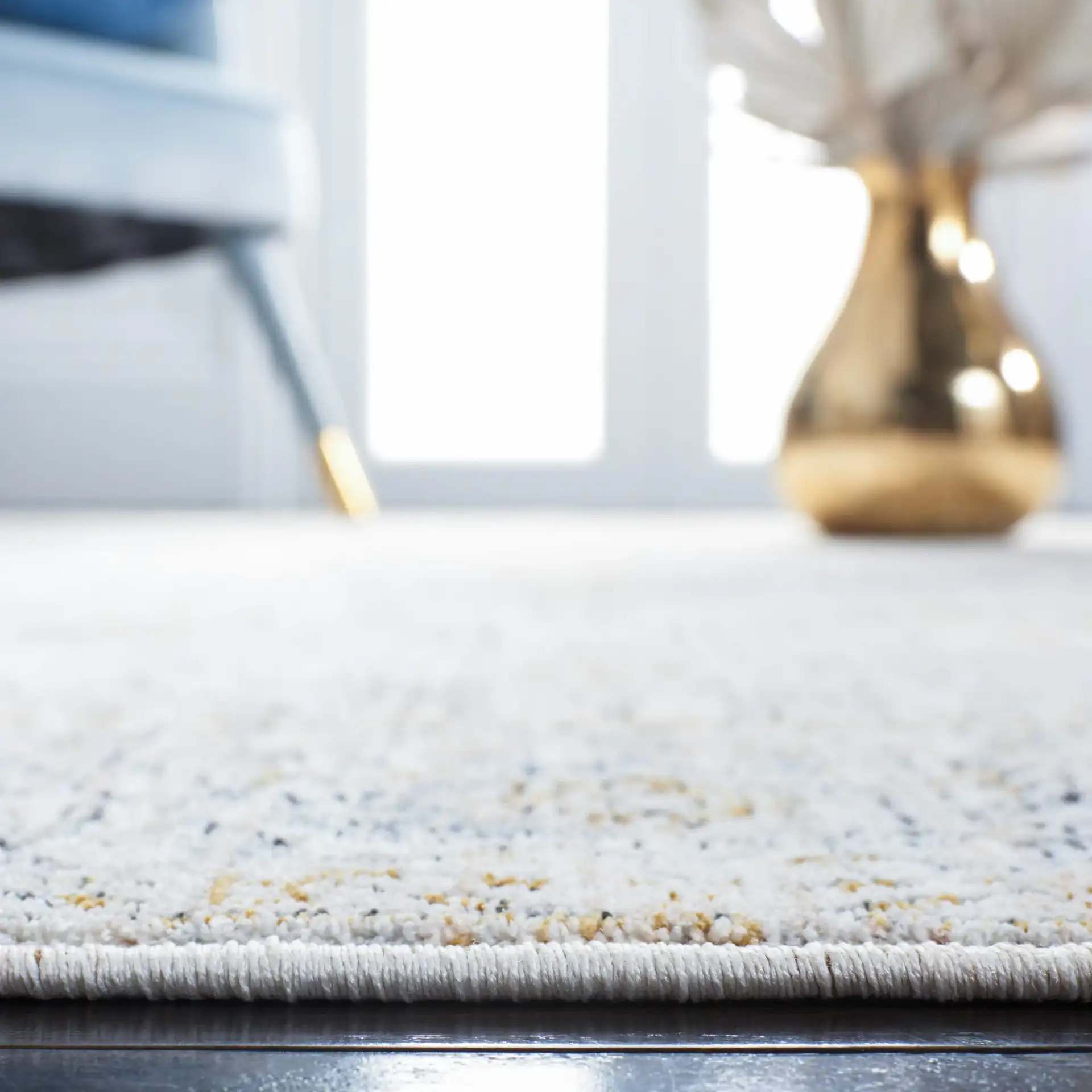 Moondust Distressed Medallion Rug in Ivory / Blue in a styled room
