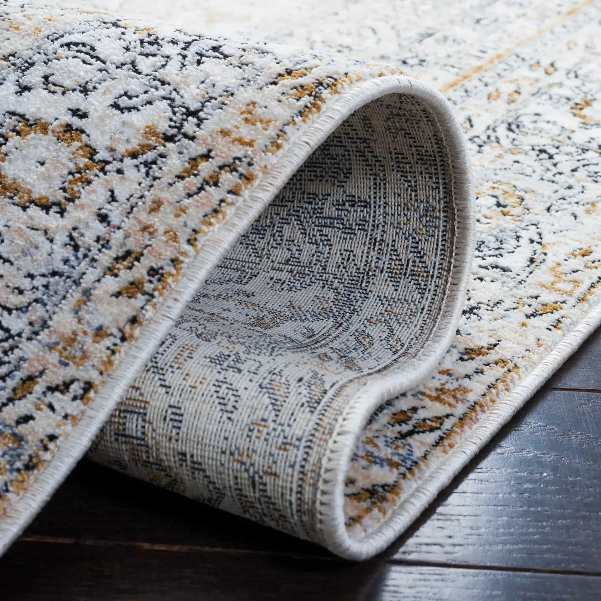 Moondust Distressed Medallion Rug in Ivory / Blue in a styled room