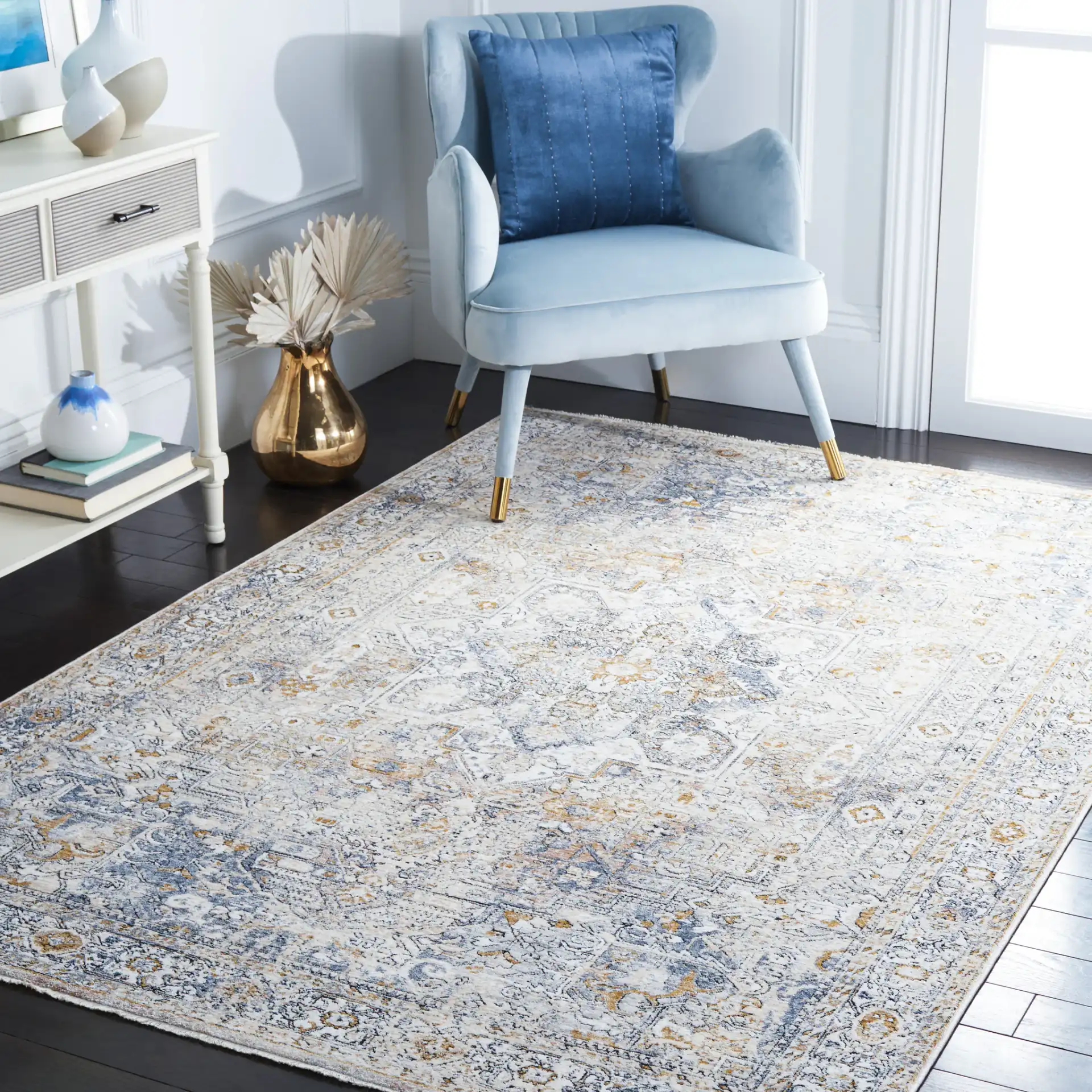Moondust Distressed Medallion Rug in Ivory / Blue in a styled room