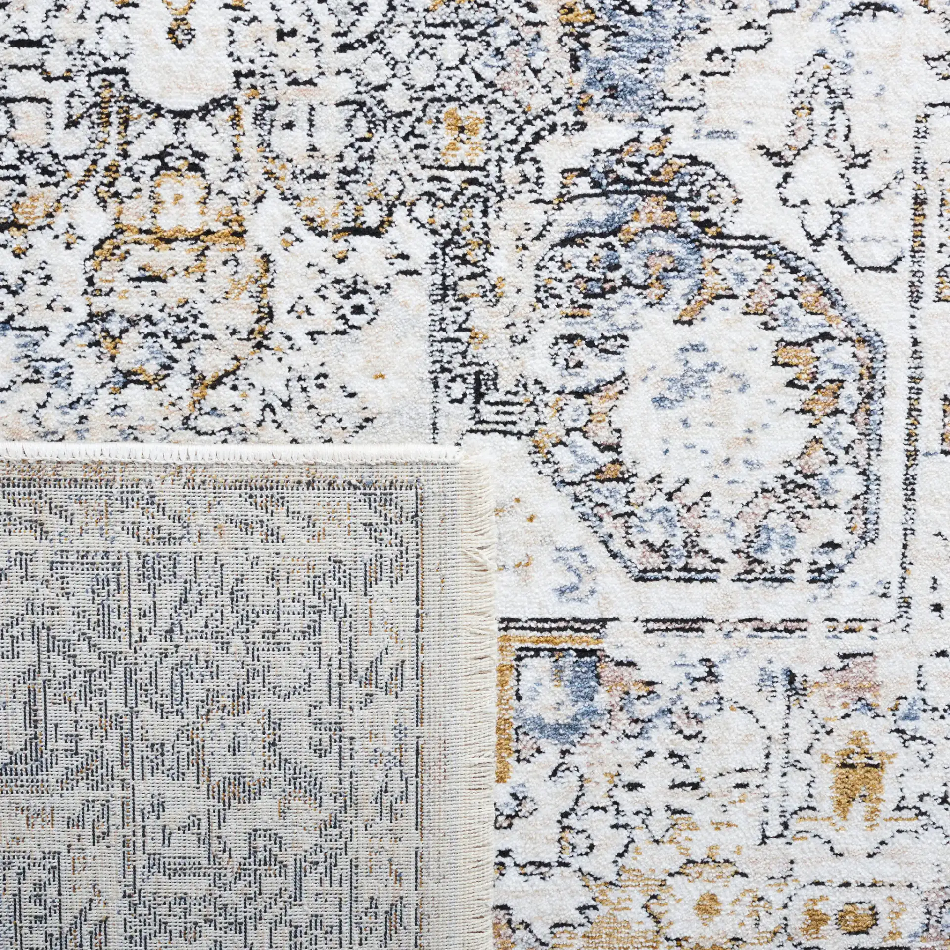 Moondust Distressed Medallion Rug in Ivory / Blue in a styled room