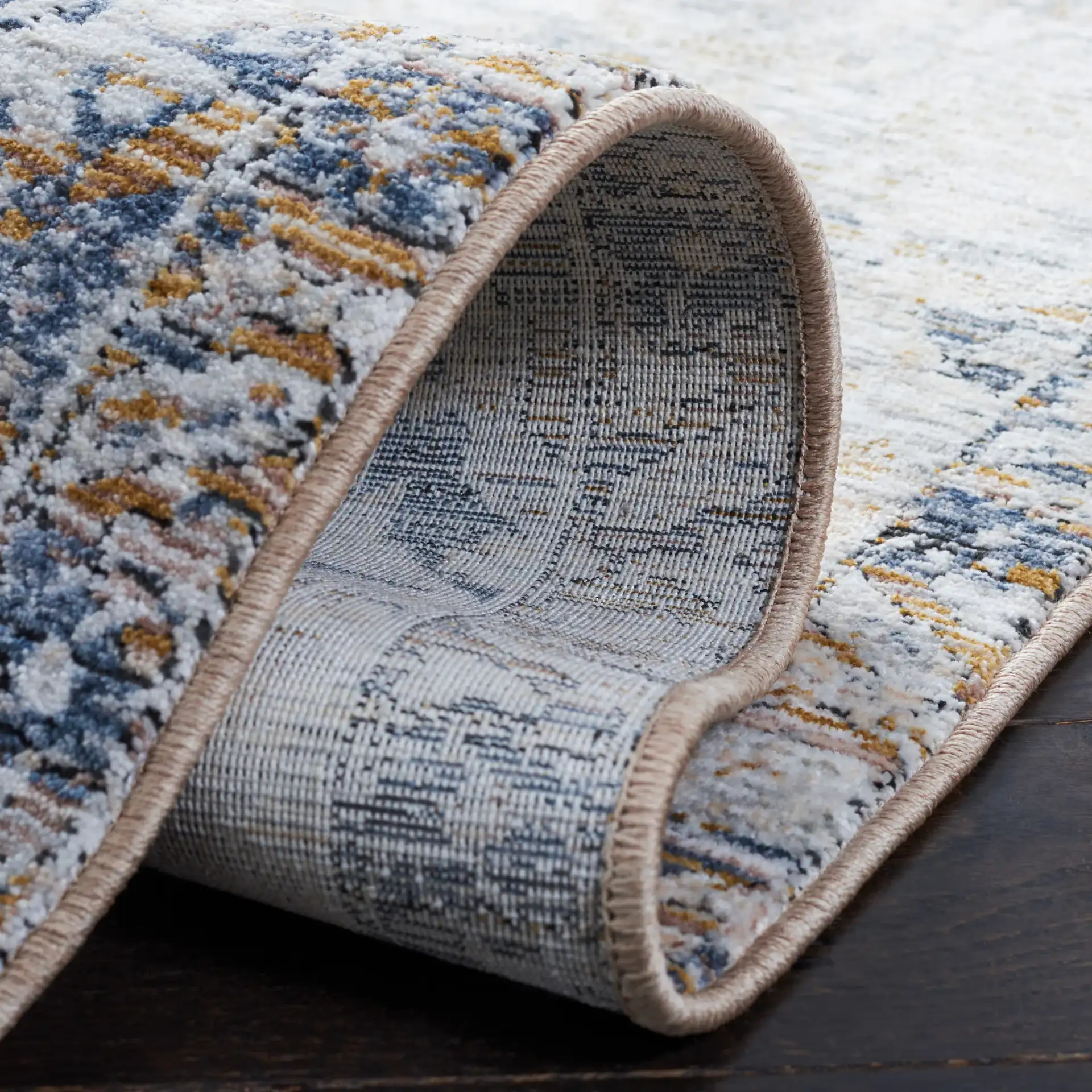 Moondust Distressed Damask Rug in Gray / Blue in a styled room