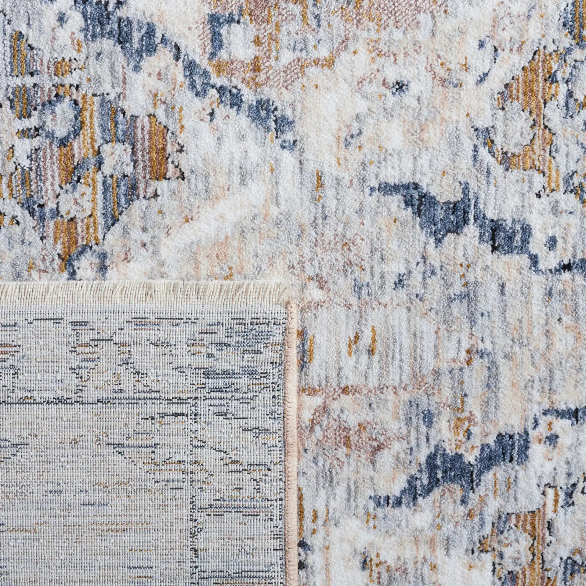 Moondust Distressed Damask Rug in Gray / Blue in a styled room