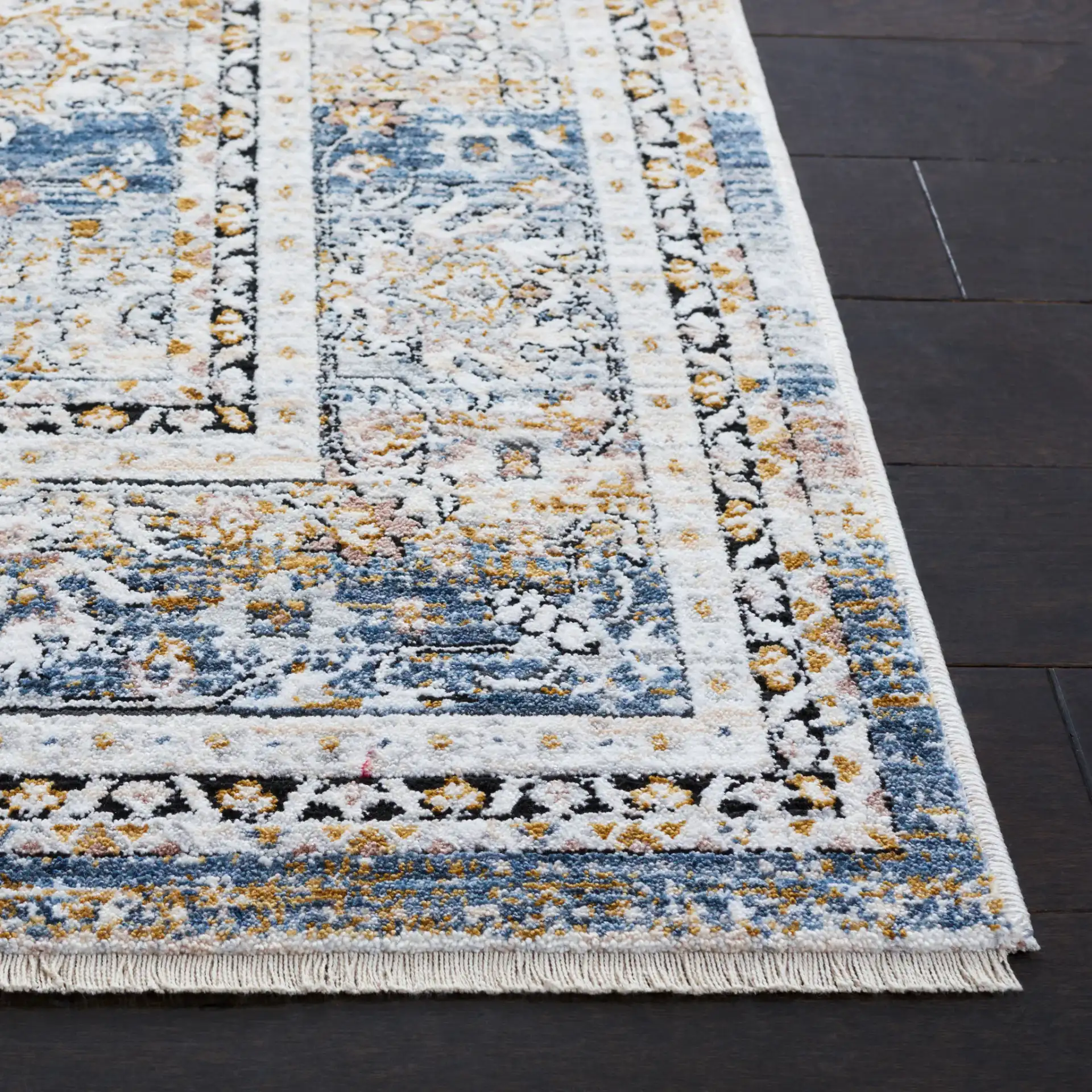 Moondust Distressed Banded Floral Rug in Blue / Gray in a styled room