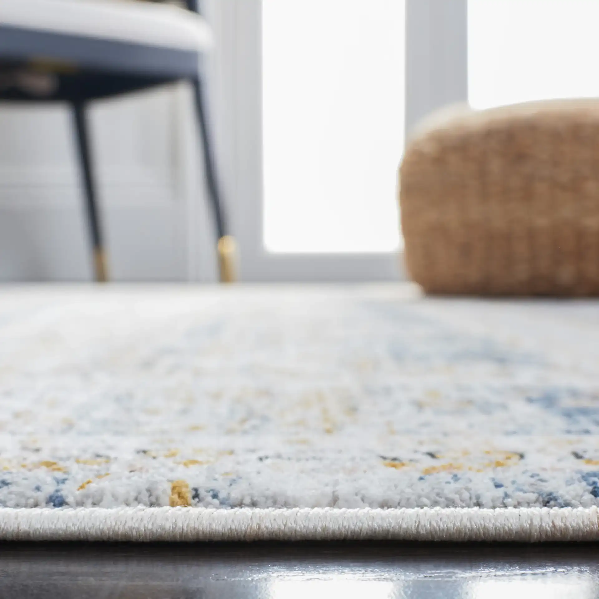 Moondust Distressed Banded Floral Rug in Blue / Gray in a styled room