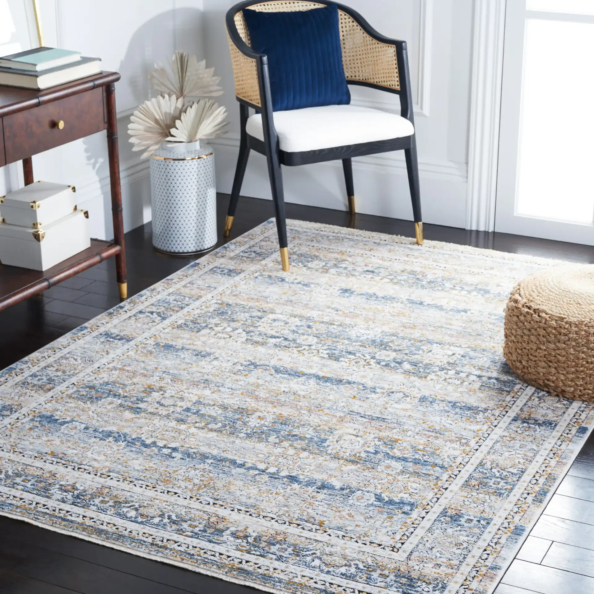 Moondust Distressed Banded Floral Rug in Blue / Gray in a styled room