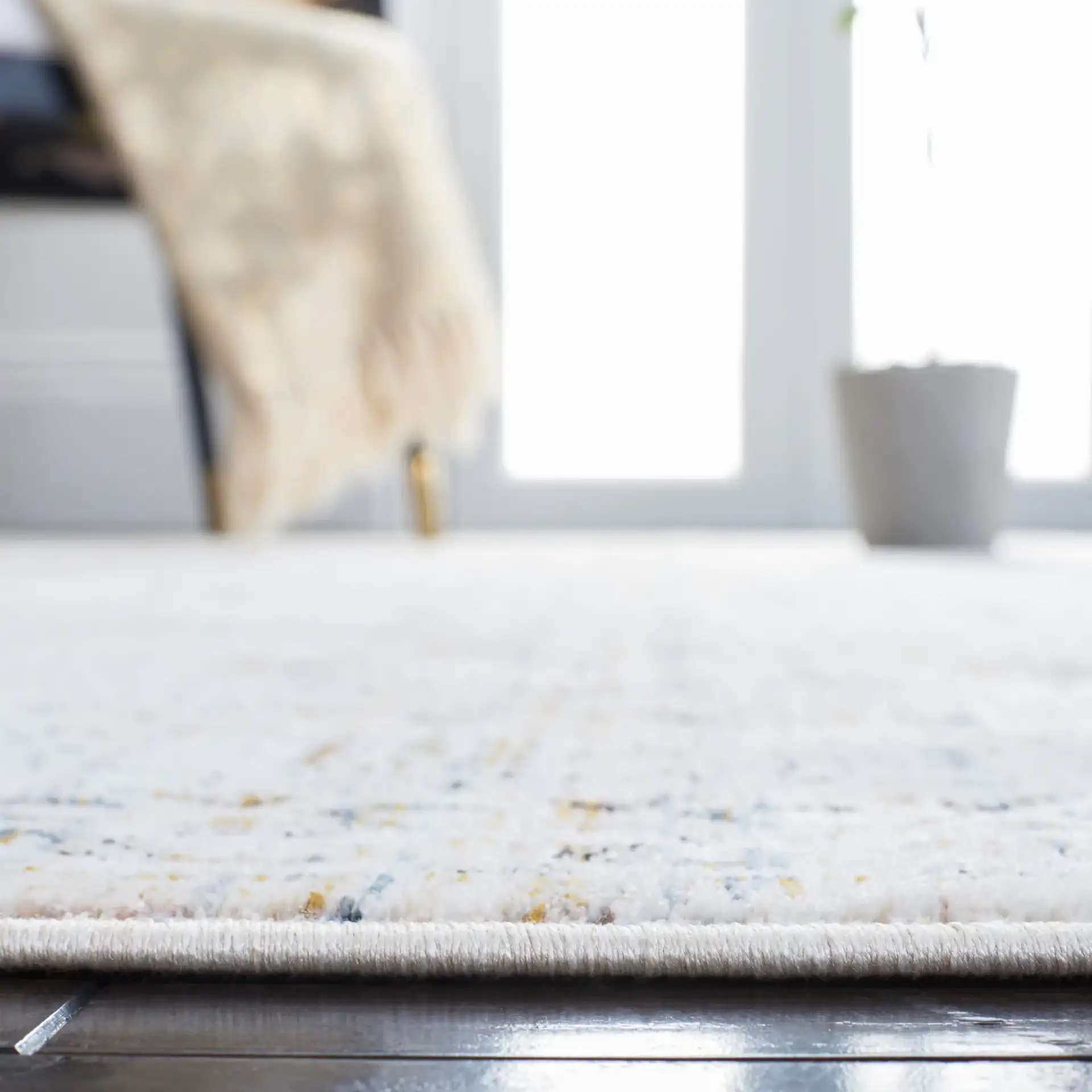 Moondust Bordered Floral Rug in Ivory / Gray in a styled room