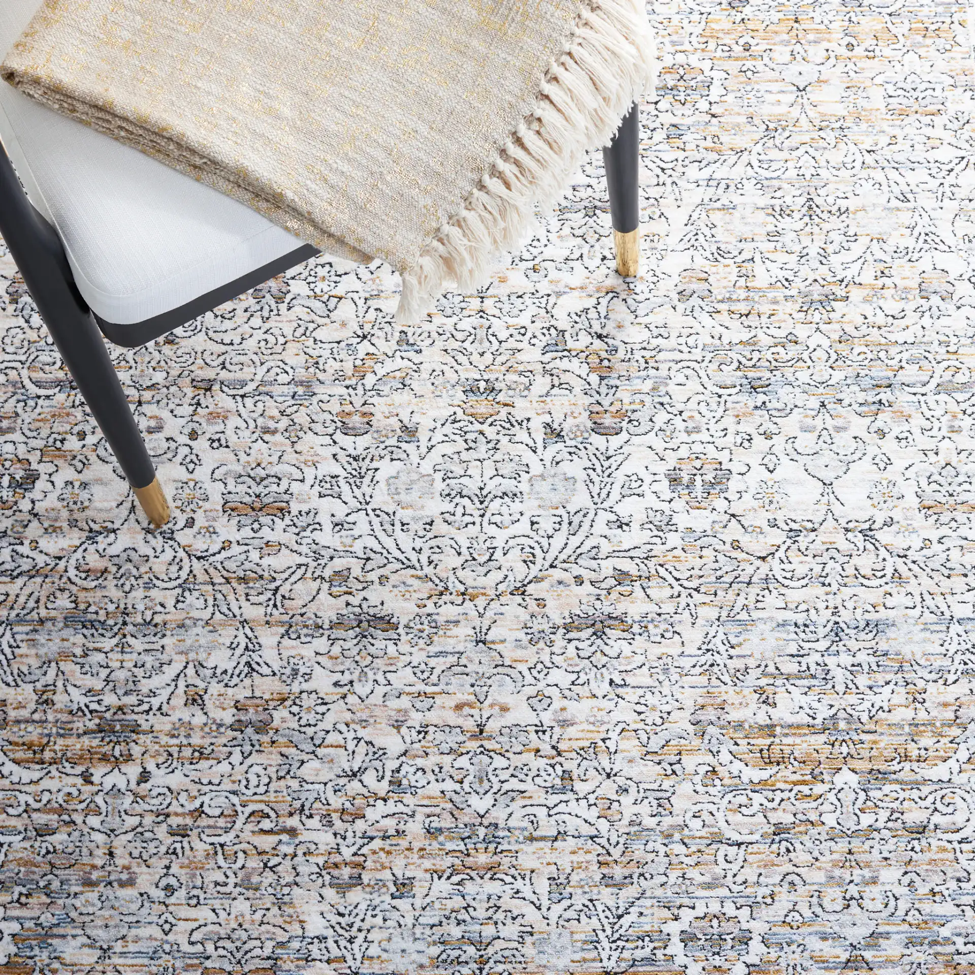 Moondust Bordered Floral Rug in Ivory / Gray in a styled room