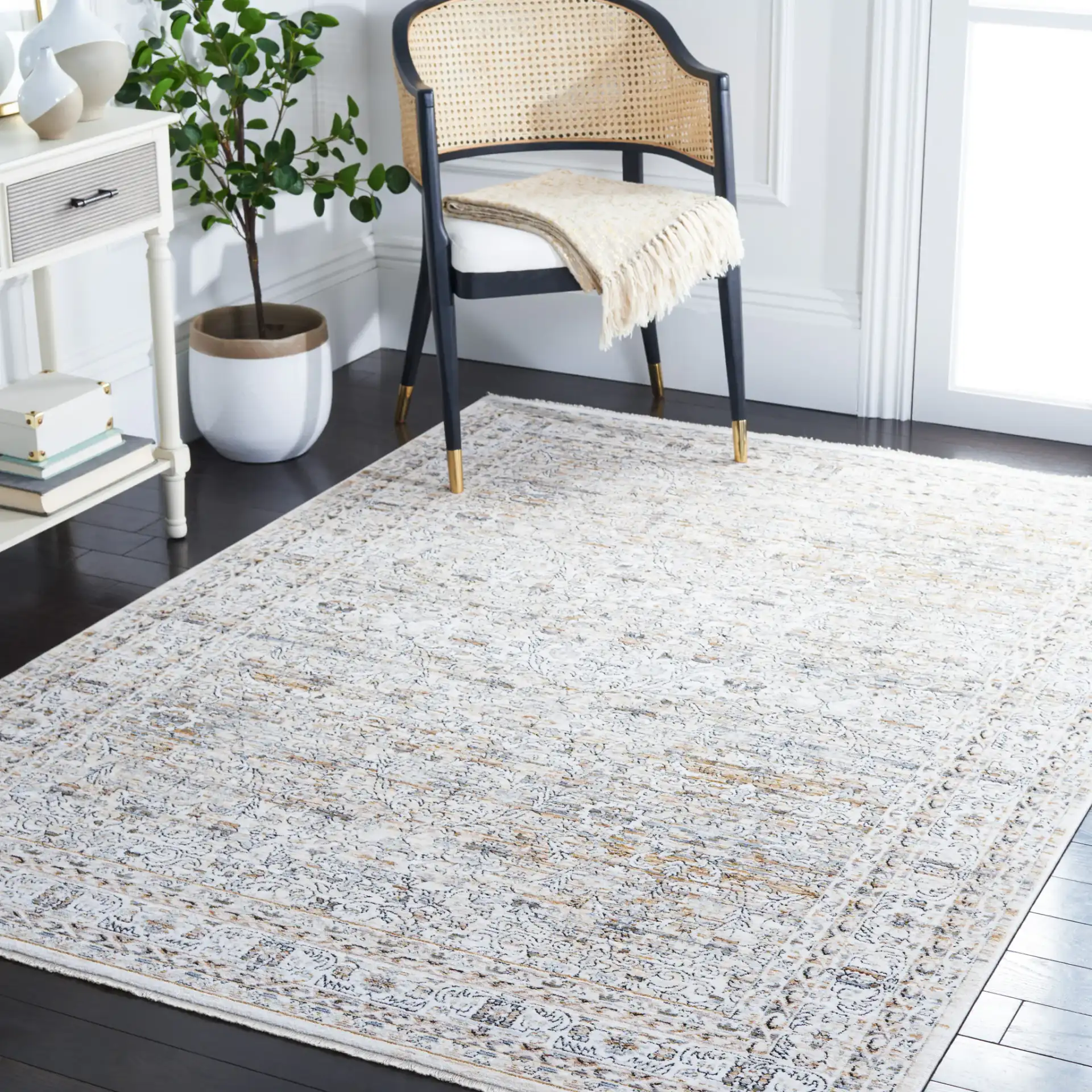 Moondust Bordered Floral Rug in Ivory / Gray in a styled room