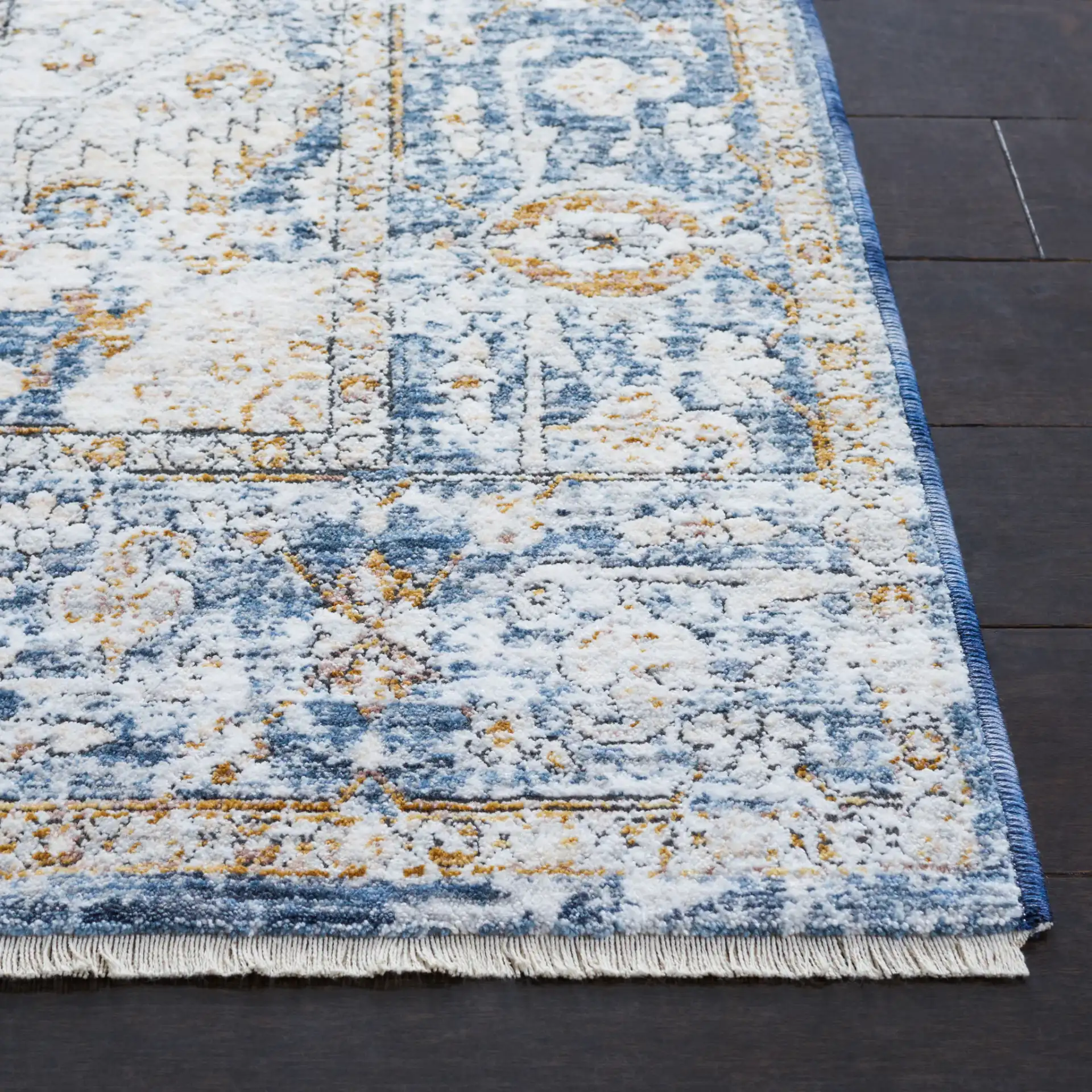 Moondust Distressed Traditional Medallion Rug in Ivory / Blue in a styled room