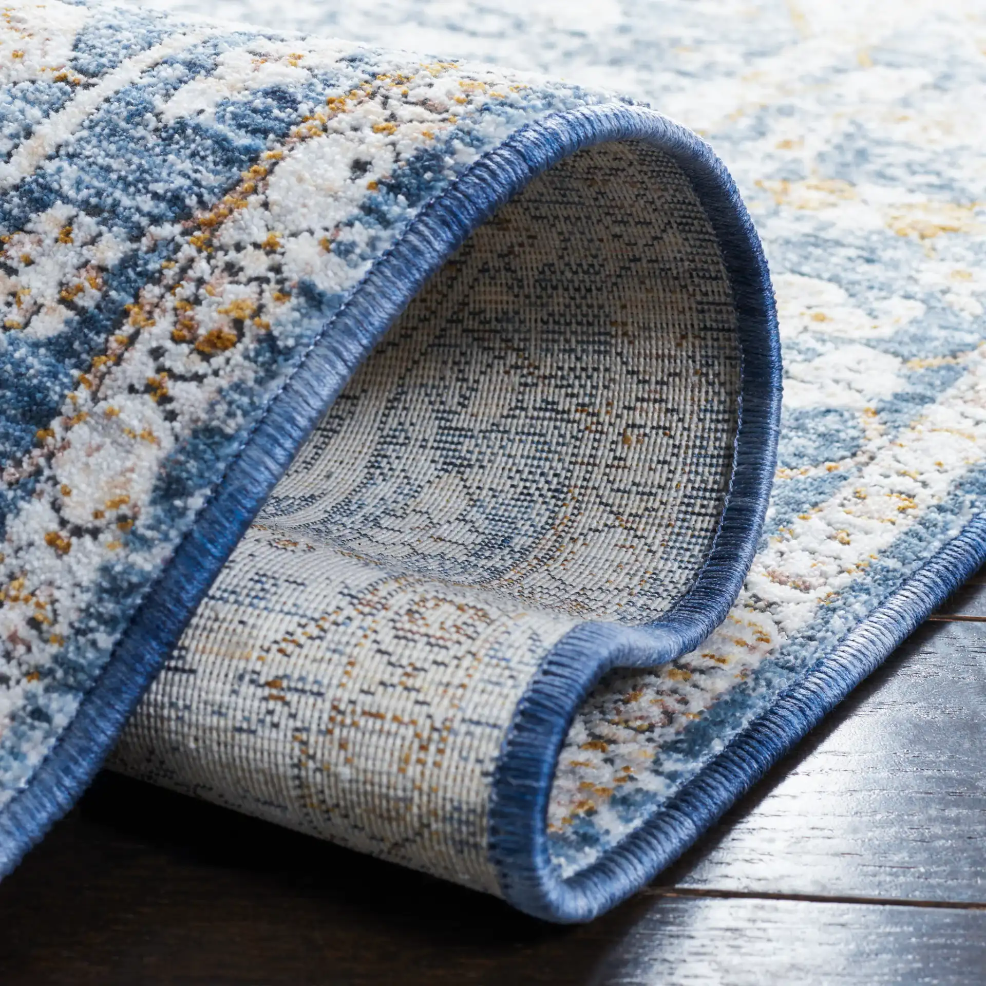 Moondust Distressed Traditional Medallion Rug in Ivory / Blue in a styled room