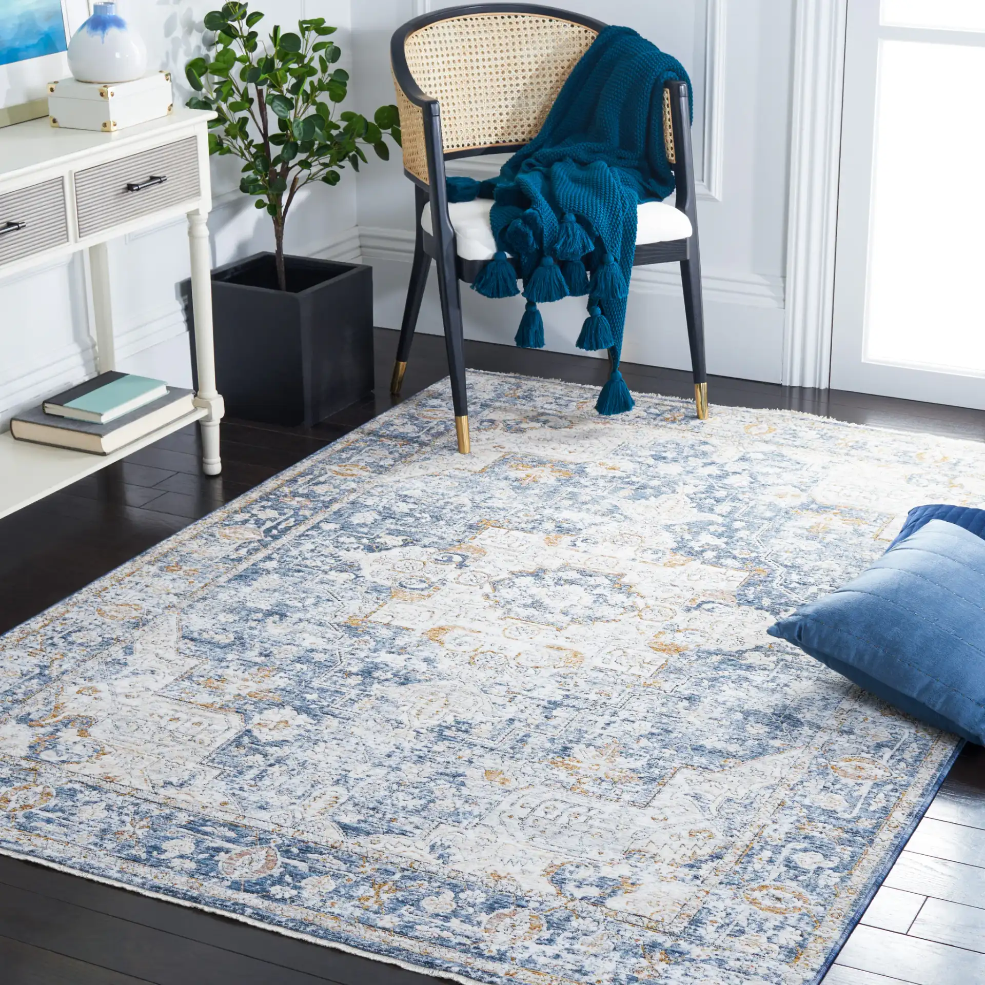 Moondust Distressed Traditional Medallion Rug in Ivory / Blue in a styled room