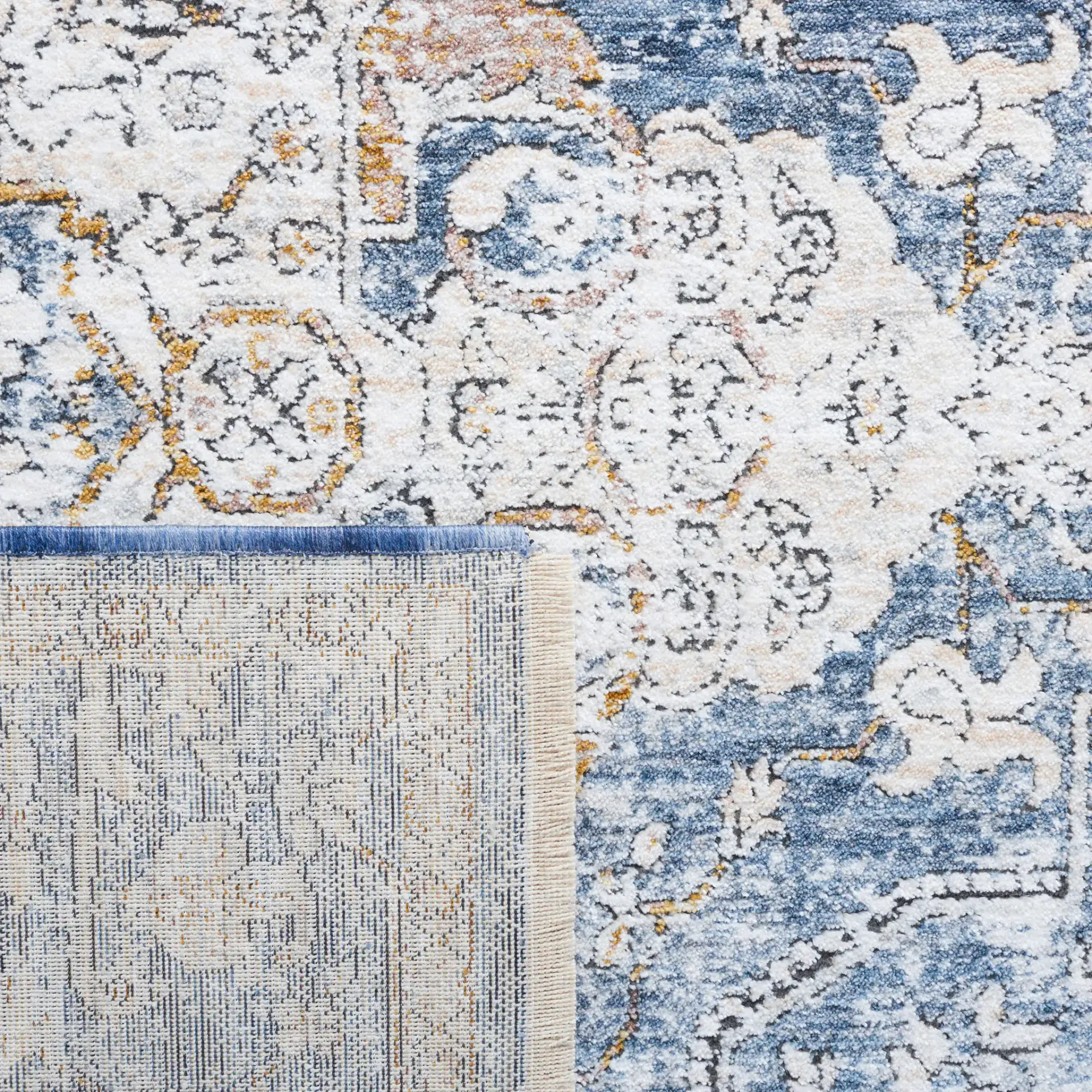 Moondust Distressed Traditional Medallion Rug in Ivory / Blue in a styled room