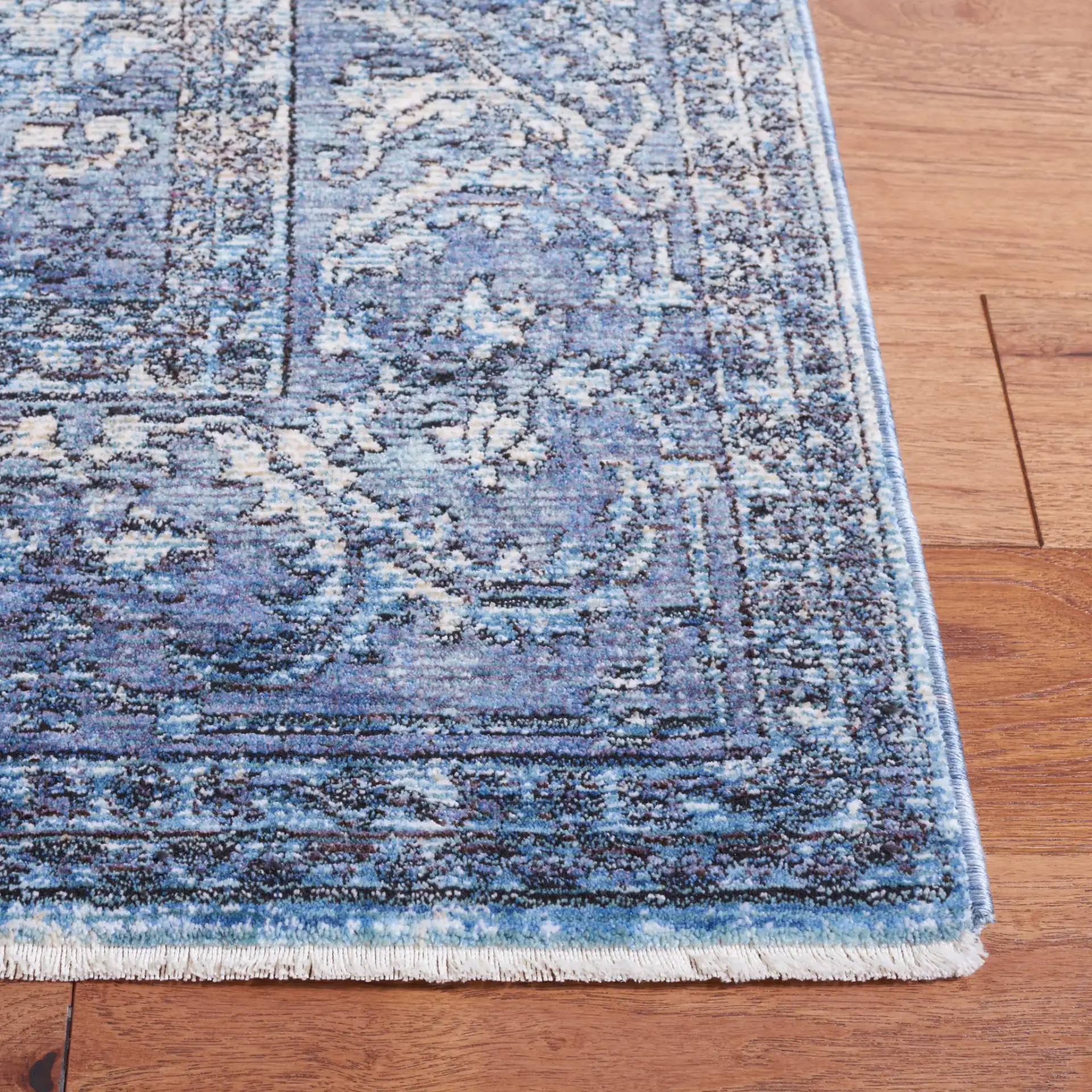Moondust Distressed Arabesque Rug in Blue / Turquoise in a styled room