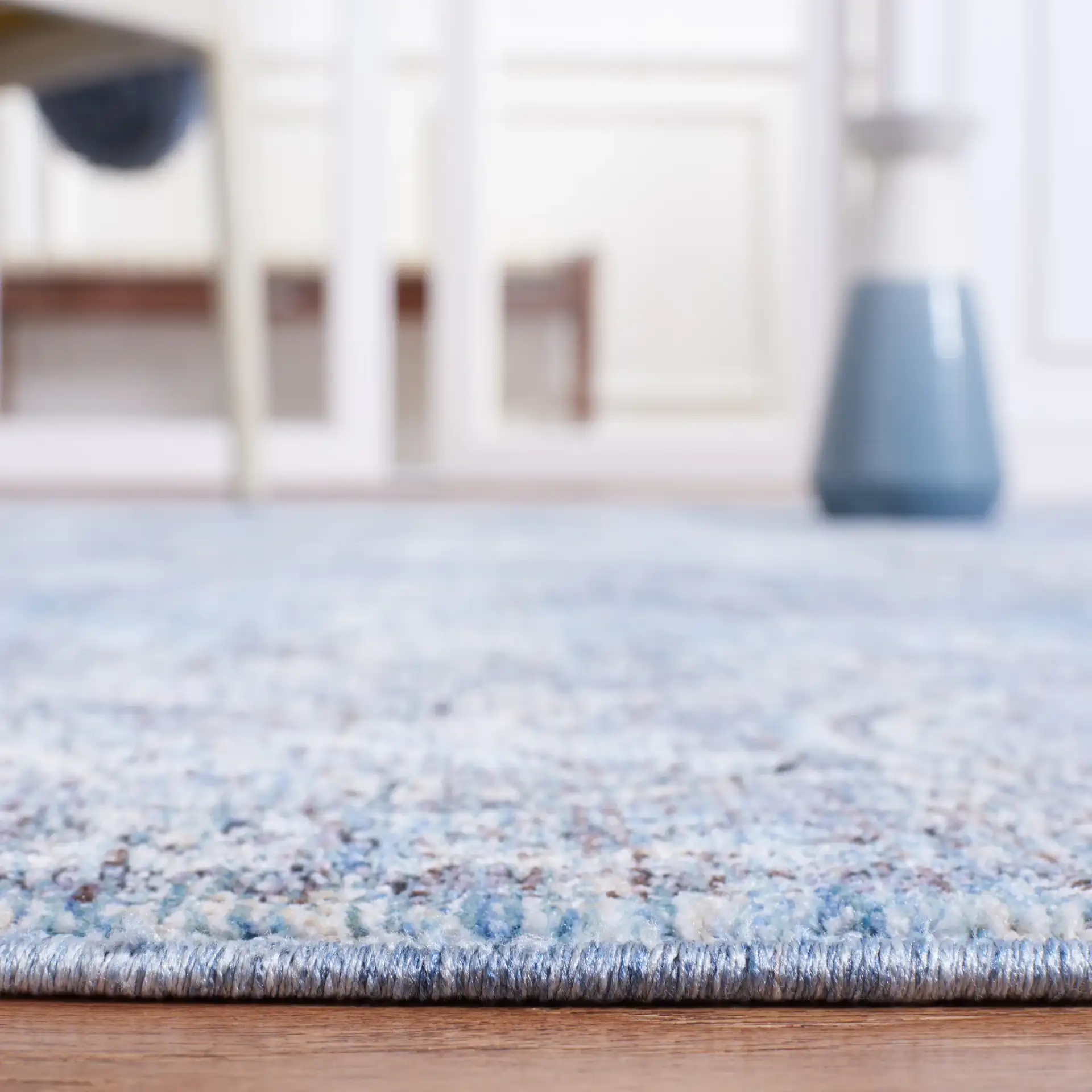 Moondust Distressed Arabesque Rug in Blue / Turquoise in a styled room