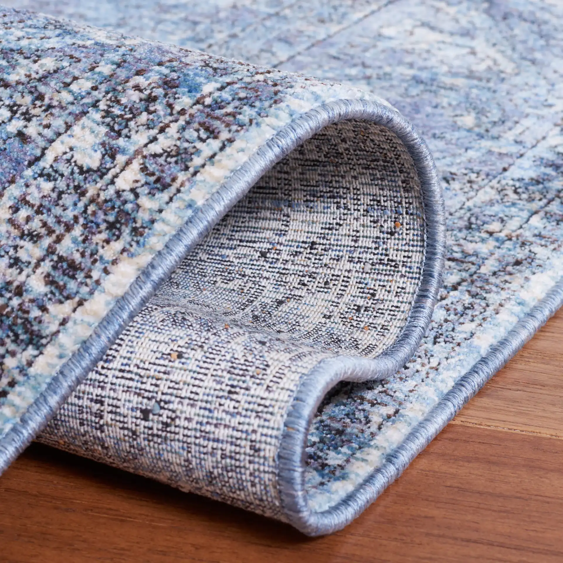 Moondust Distressed Arabesque Rug in Blue / Turquoise in a styled room