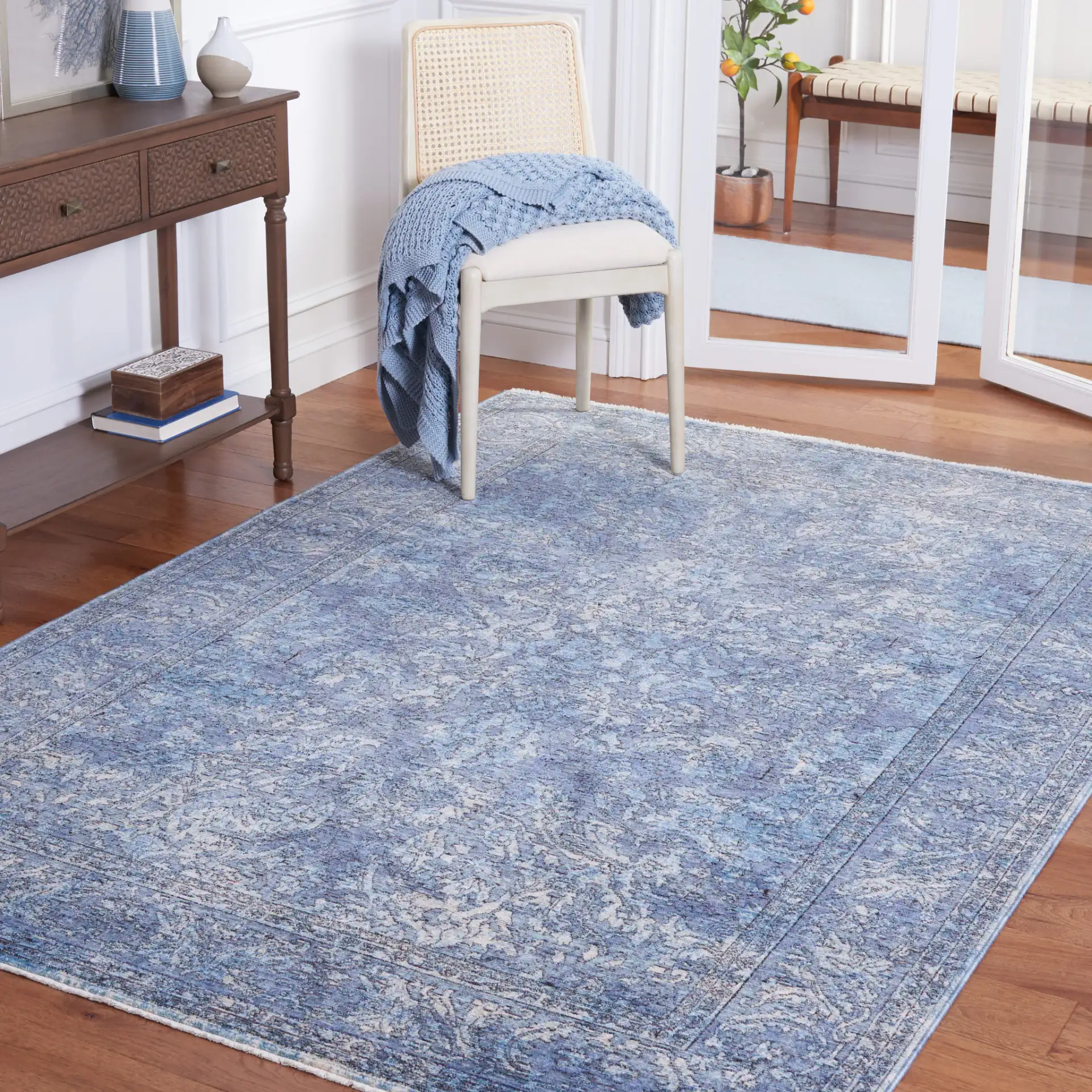 Moondust Distressed Arabesque Rug in Blue / Turquoise in a styled room